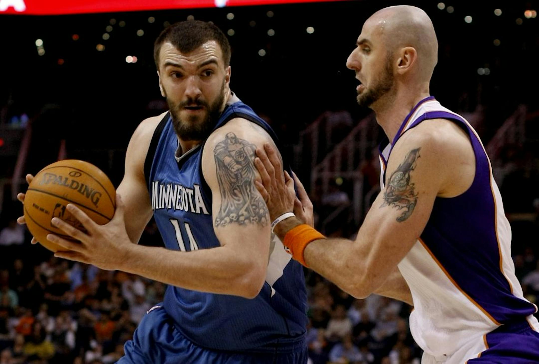 Timberwolves center Nikola Pekovic, left