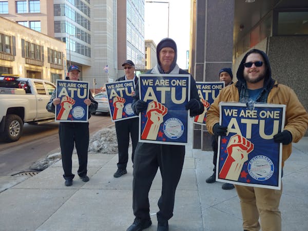 Members of the Amalgamated Transit Union Local 1005 protested outside the Metropolitan Council’s headquarters in St. Paul over safety conditions on 
