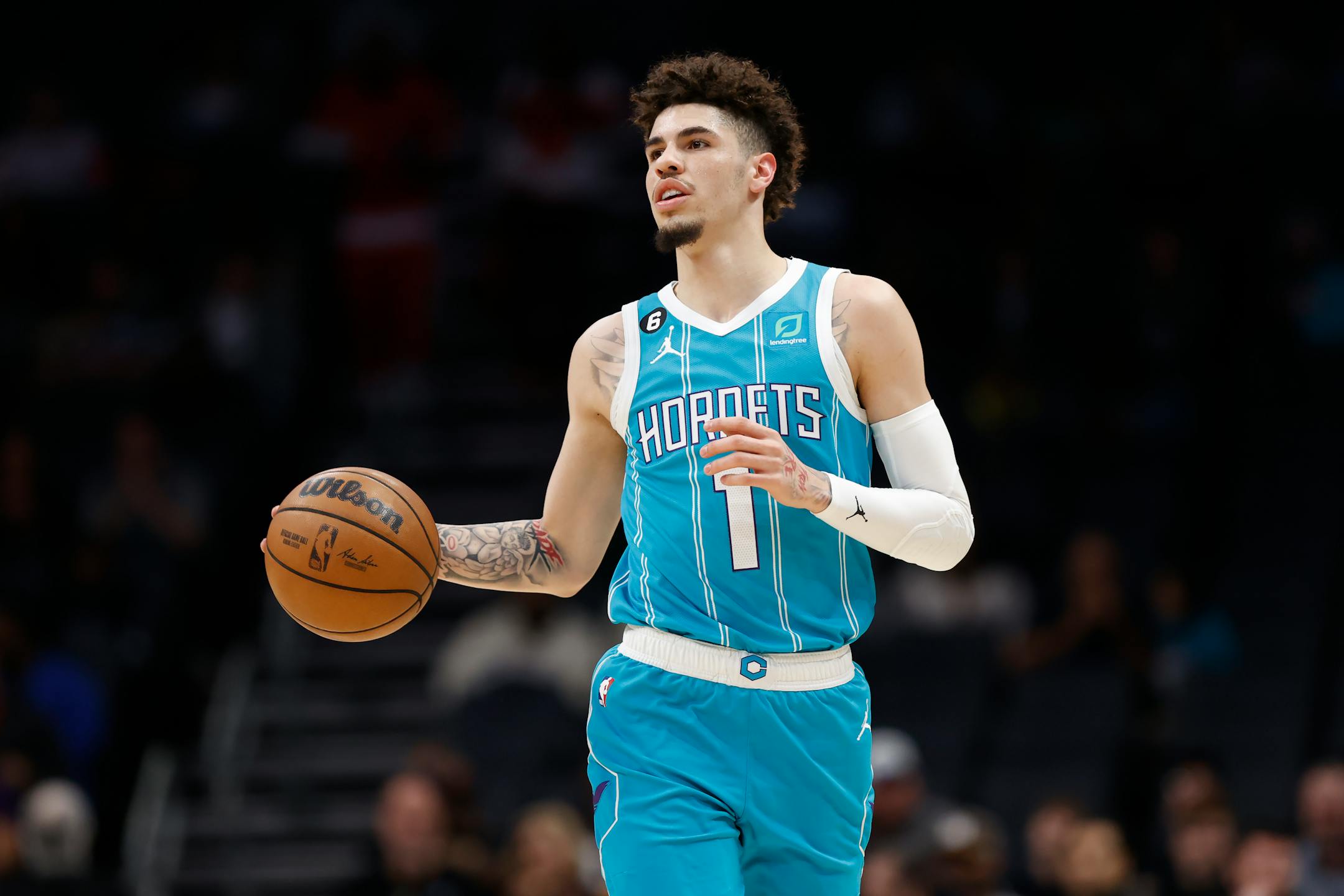 Charlotte Hornets guard LaMelo Ball brings the ball up during the first half of the team's NBA basketball game against the San Antonio Spurs on Wednesday, Feb. 15, 2023, in Charlotte, N.C. (AP Photo/Brian Westerholt)