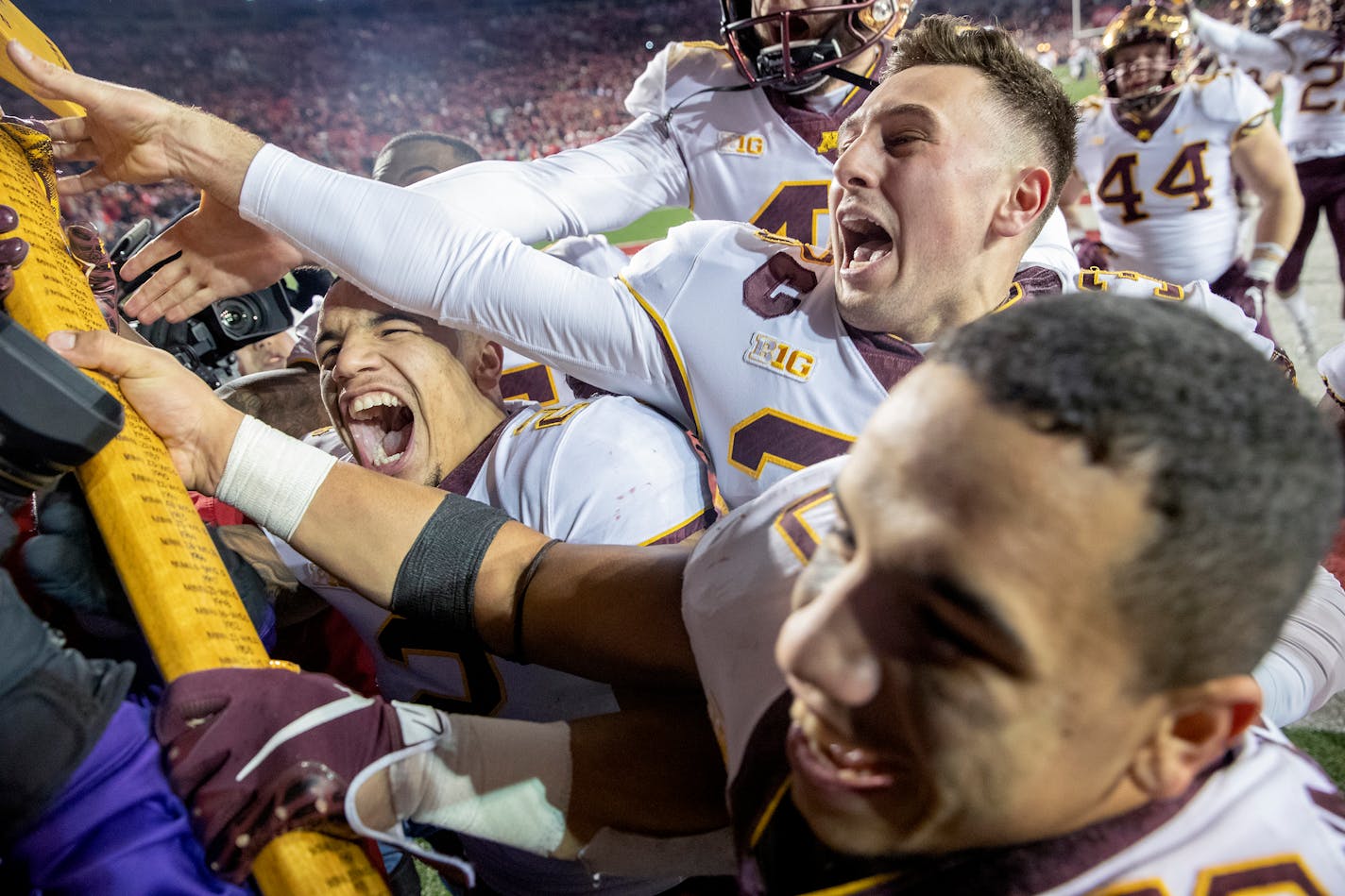 With 27 seconds still left, Gophers players raced to grab Paul Bunyan's Axe as Minnesota defeated Wisconsin 37-15 at Camp Randall Stadium on Saturday.