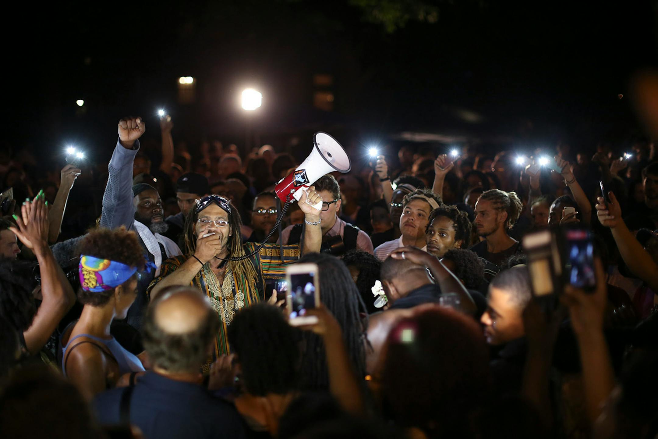 A speaker in front of the Governor's Residence called for the crowd to boycott the State Fair.
