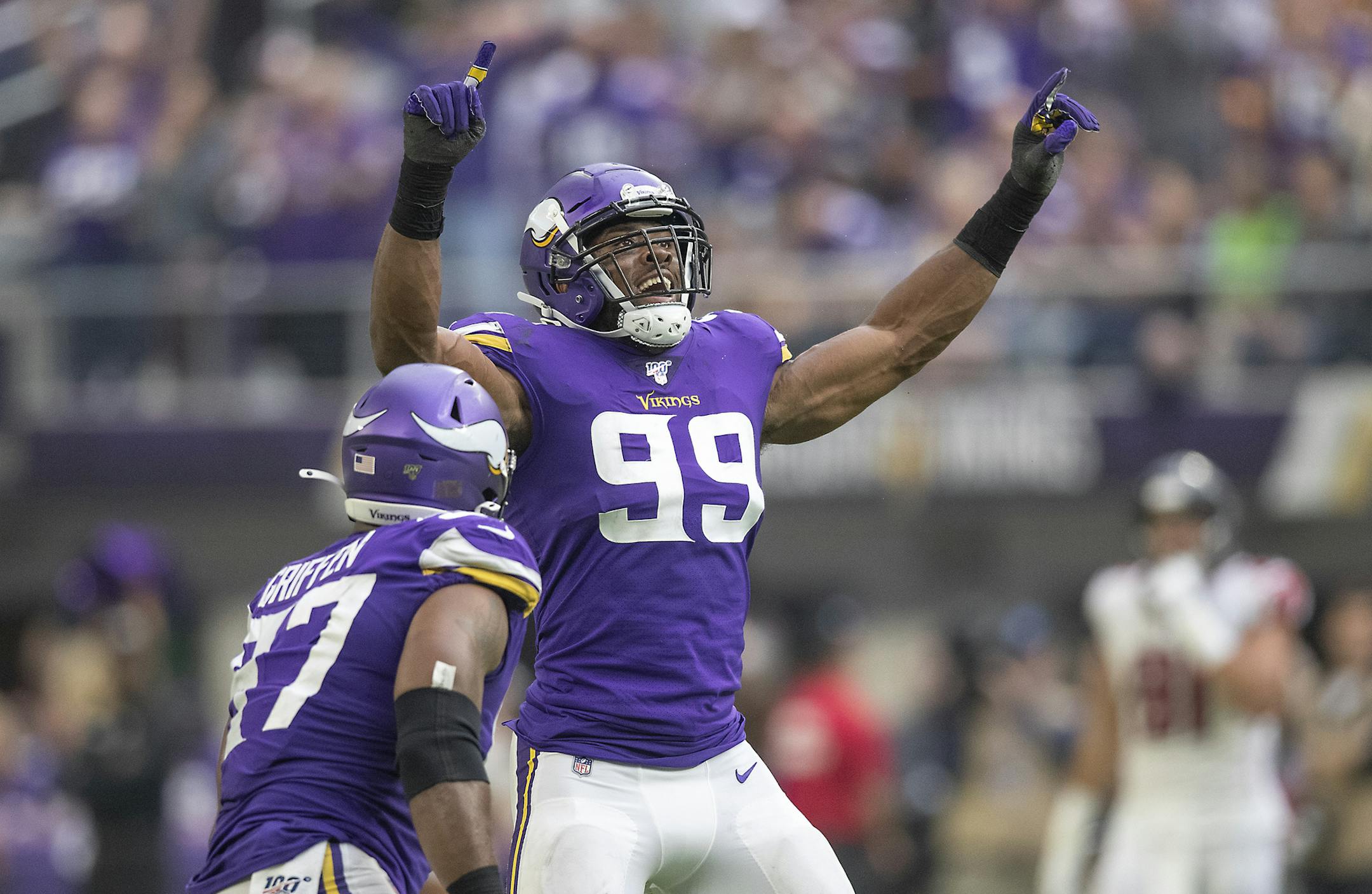 Vikings defensive end Danielle Hunter (99) celebrated a sack with Everson Griffen in the second quarter against the Falcons on Sunday.