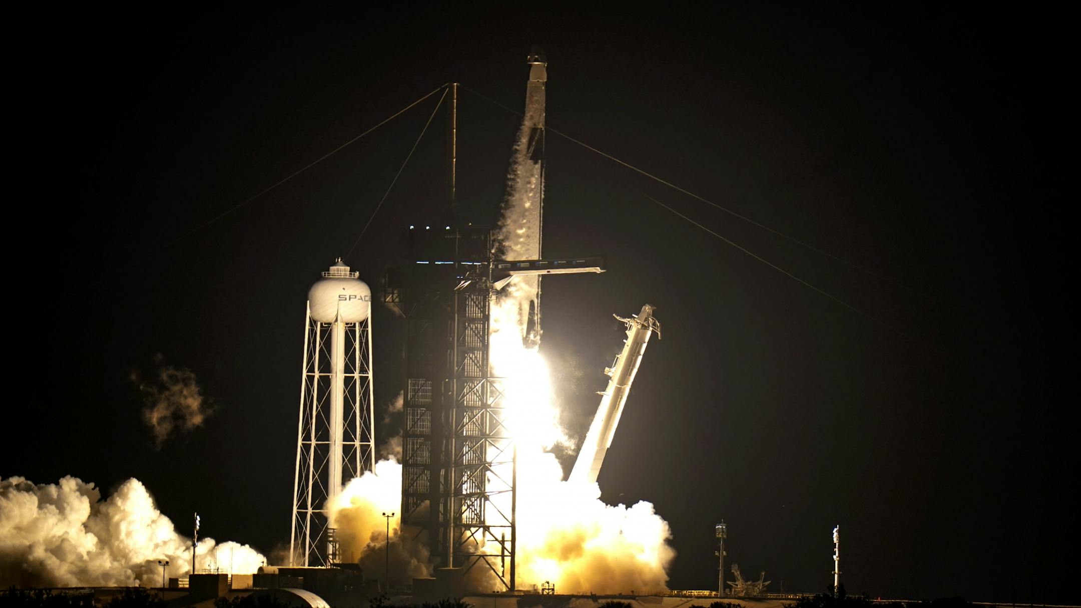 A Falcon 9 SpaceX rocket with the Crew Dragon capsule lifts off from pad 39A at the Kennedy Space Center in Cape Canaveral, Fla., Sunday, Nov. 15, 2020. Four astronauts are beginning a mission to the International Space Station.