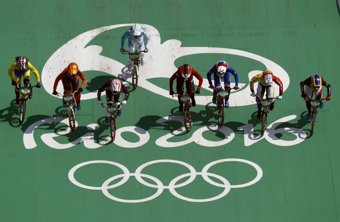 Cyclists, from right, Mariana Pajon of Colombia, Stefany Hernandez of Venezuela, Manon Valentino of France, Simone Christensen of Denmark, Maria Gabriela Diaz of Argentina, Alise Post of the United States, merle van Benthem of the Netherlands, Amanda Carr of Thailand compete in the women's BMX cycling semifinals during the 2016 Summer Olympics in Rio de Janeiro, Brazil, Friday, Aug. 19, 2016.