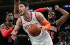 New York Knicks center Enes Kanter (00) drives to the basket against the Chicago Bulls during the first quarter of an NBA basketball game, Monday, Mar