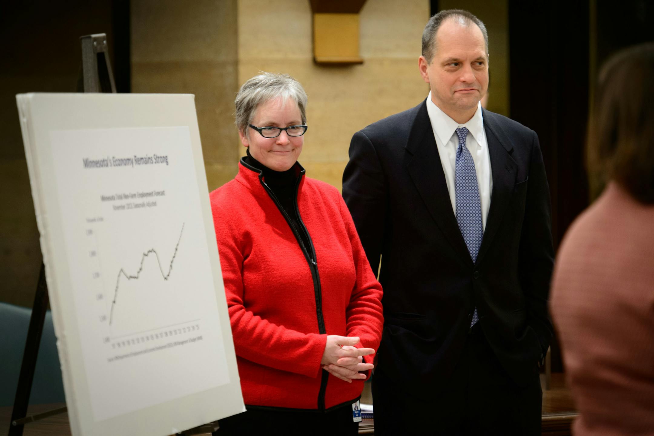 State Budget Director Margaret Kelly and MMB Commissioner Jim Schowalter smiled as State Economist Dr. Laura Kalambokidis talked about the budget surplus. On Thursday, Dec. 5, 2013, Minnesota budget officials release their new budget and an economic forecast as the state continues to rebound from the recession.