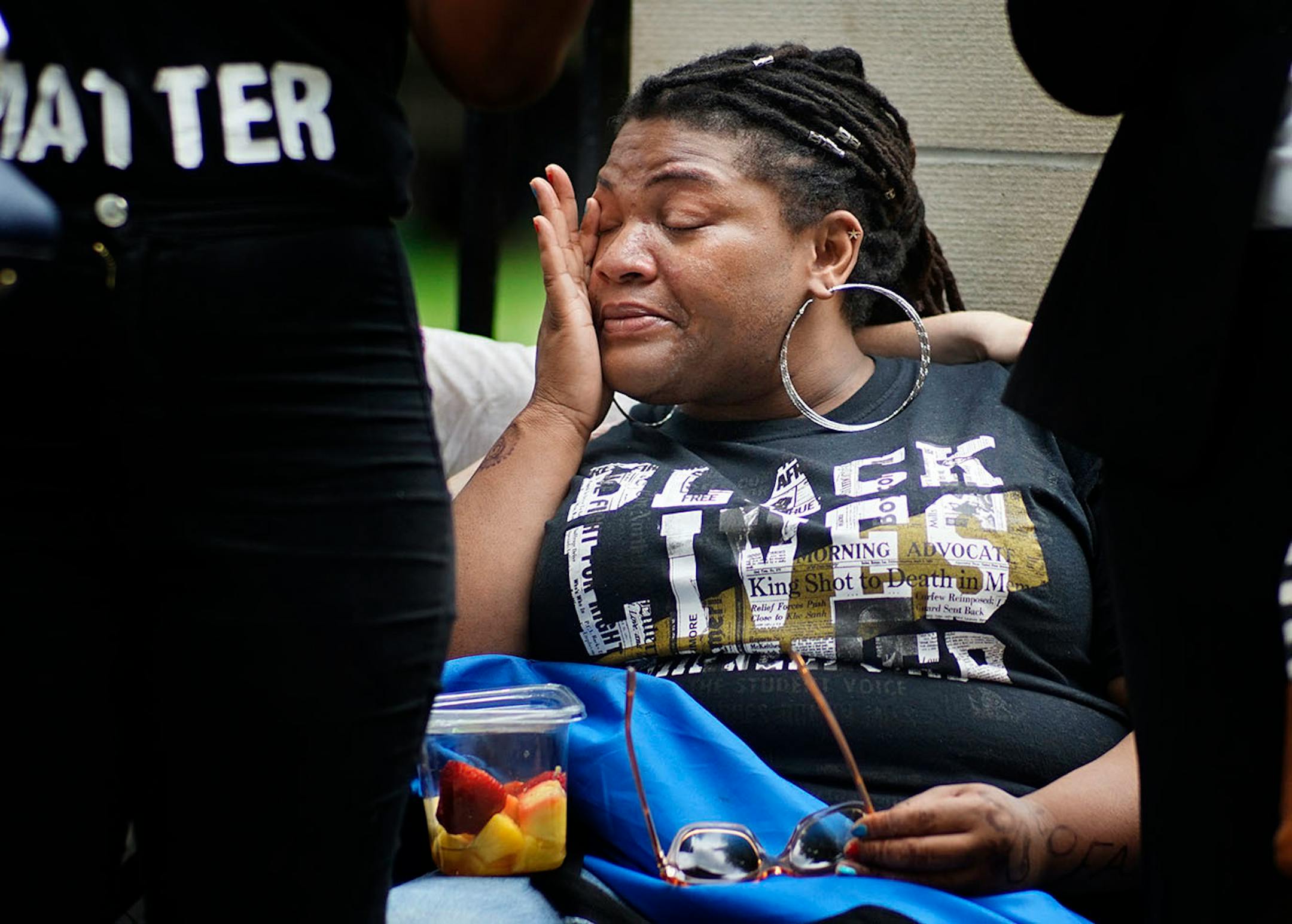 Shvone Johnson shed tears during speeches. She went through the Black Lives Matter protests on the North side.