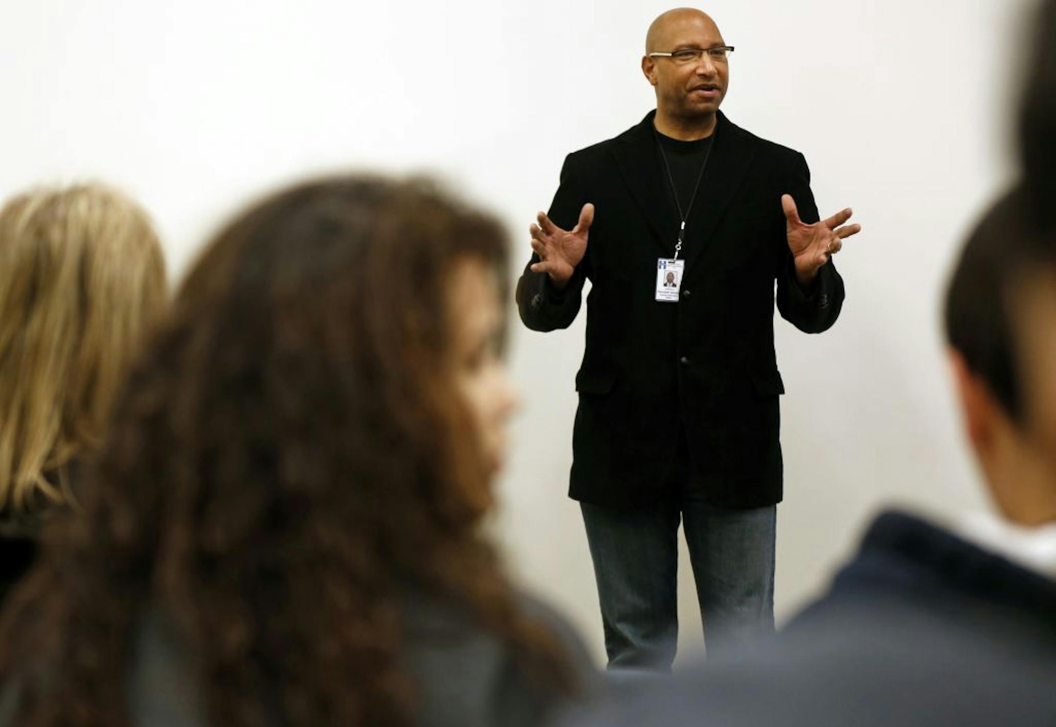 At the Southdale Library, Kenneth Garnier, a social worker, facilitated a meeting with parents and students to address the issue of truancy and its consequences.