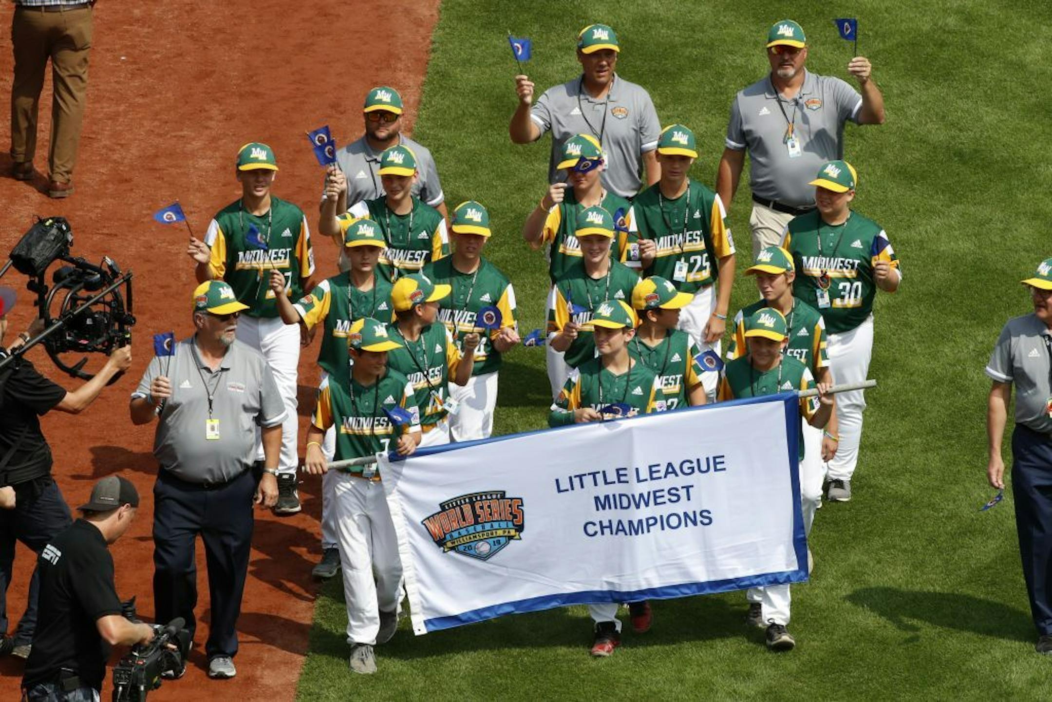 The Midwest Region Champion Little League team from Coon Rapids, Minn., participates in the opening ceremony of the 2019 Little League World Series tournament in South Williamsport, Pa., Thursday, Aug. 15, 2019.
