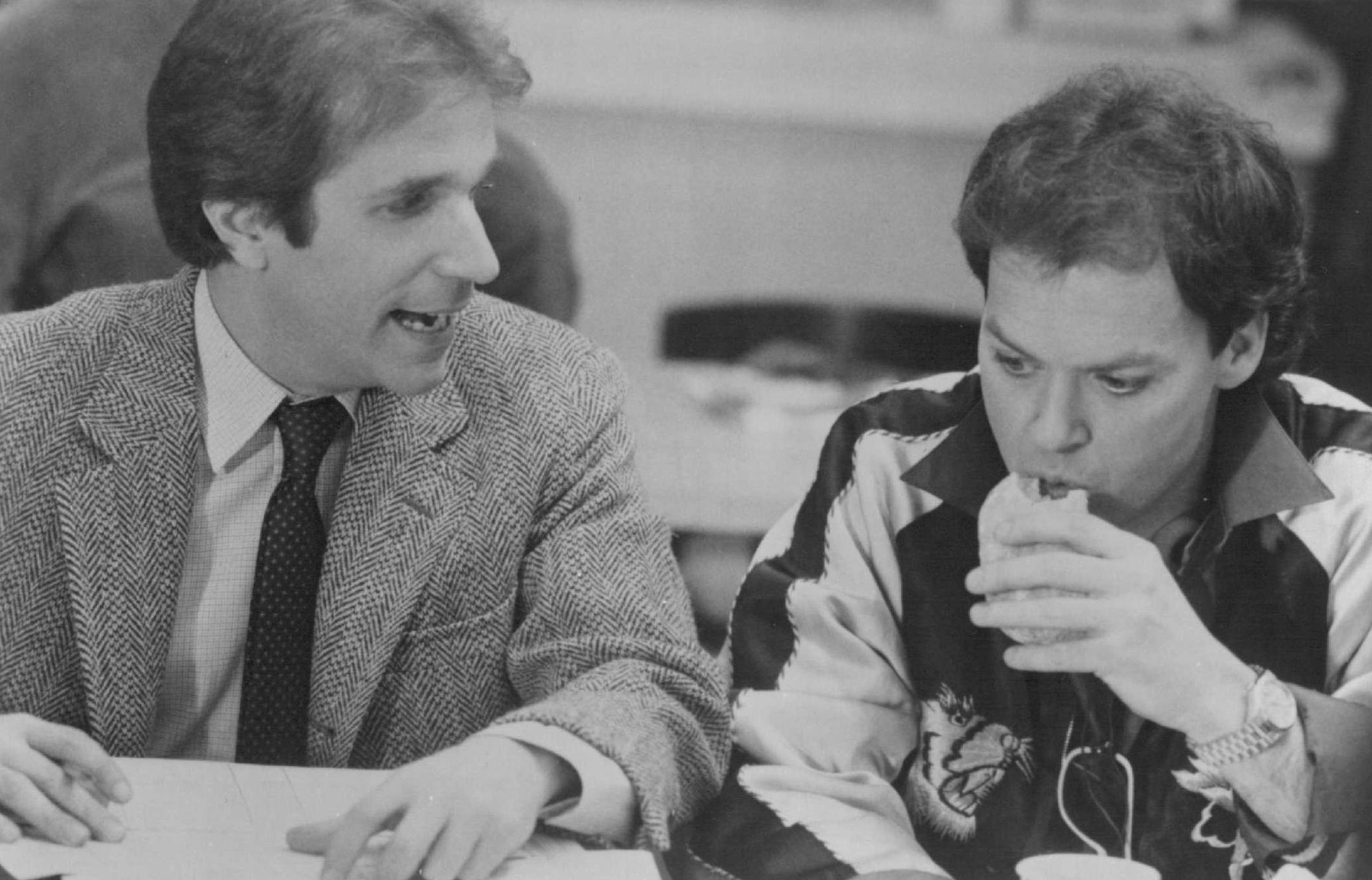 August 1984 Henry Winkler (L) co-stars as Chuck Lumley with Michael Keaton (R) as Billy Blazejowski in "Night Shift," beginning in August on The Movie Channel. They team-up to work the night shift at a morgue and decide to operate another type of money-making venture. The Movie Channel