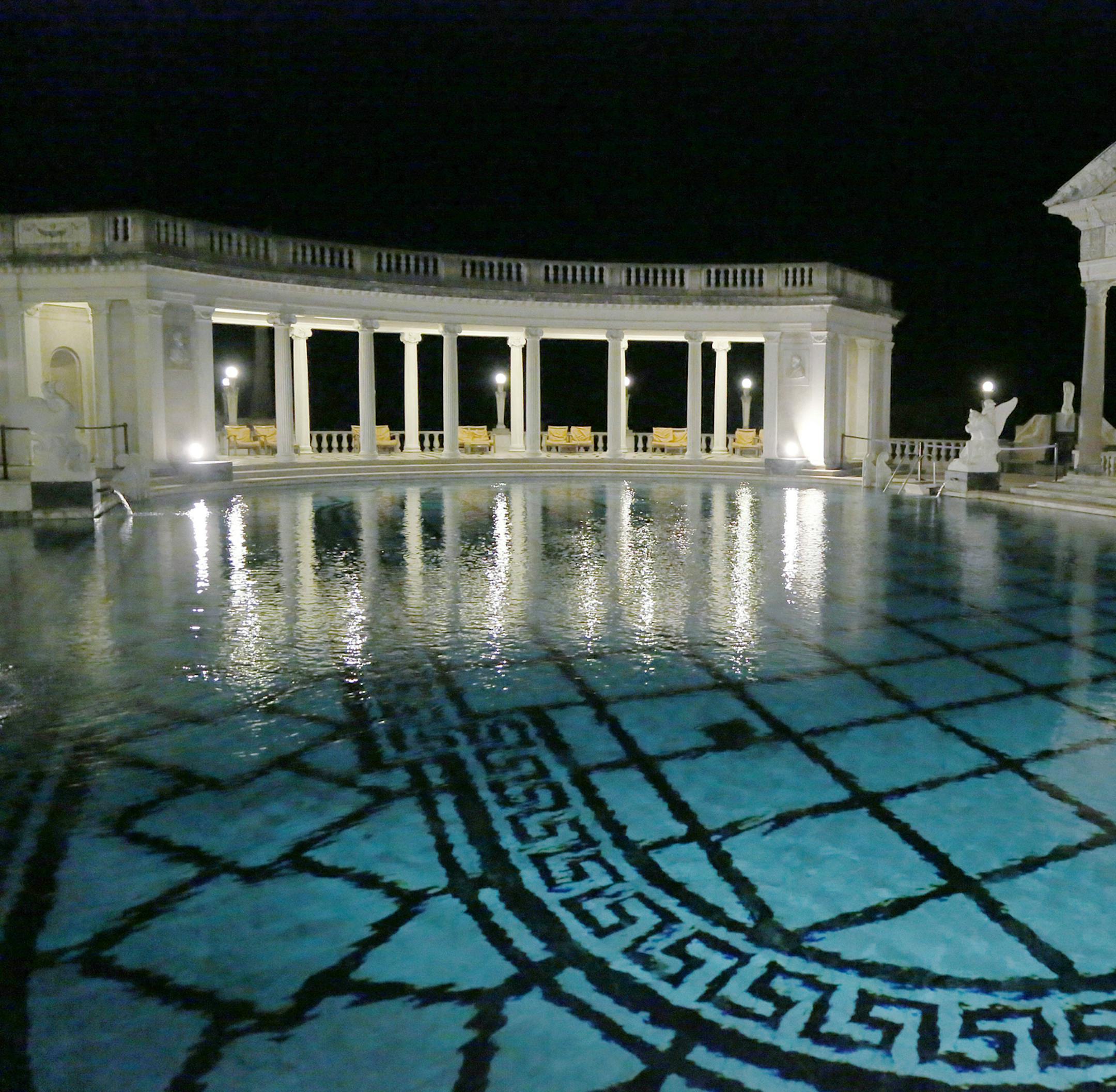 FILE - This Dec. 5, 2013, file photo, shows the Neptune Pool on the grounds of Hearst Castle, the former home of publishing magnate William Randolph Hearst, in San Simeon, Calif. Members of The Foundation at Hearst Castle will be among the few allowed to swim in the California landmark's iconic pools. Special fundraising events starting in July will allow members only to pay for a swim in the Neptune Pool on four dates this year and two other nights at the indoor Roman Pool. (AP Photo/Reed Saxon