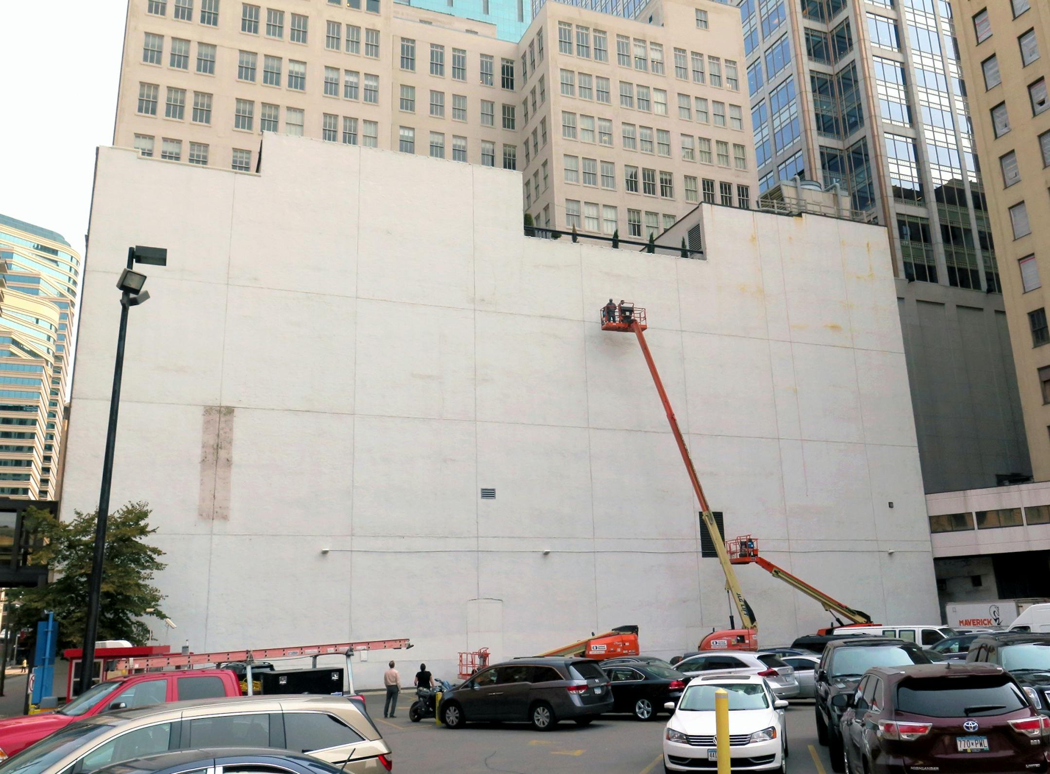 The blank white wall facing the corner of 5th and Hennipen Av will become the 'canvas' for a mural by Brazillian artist Kobra- with an image of Bob Dylan. Photo taken 8/25 as work begings