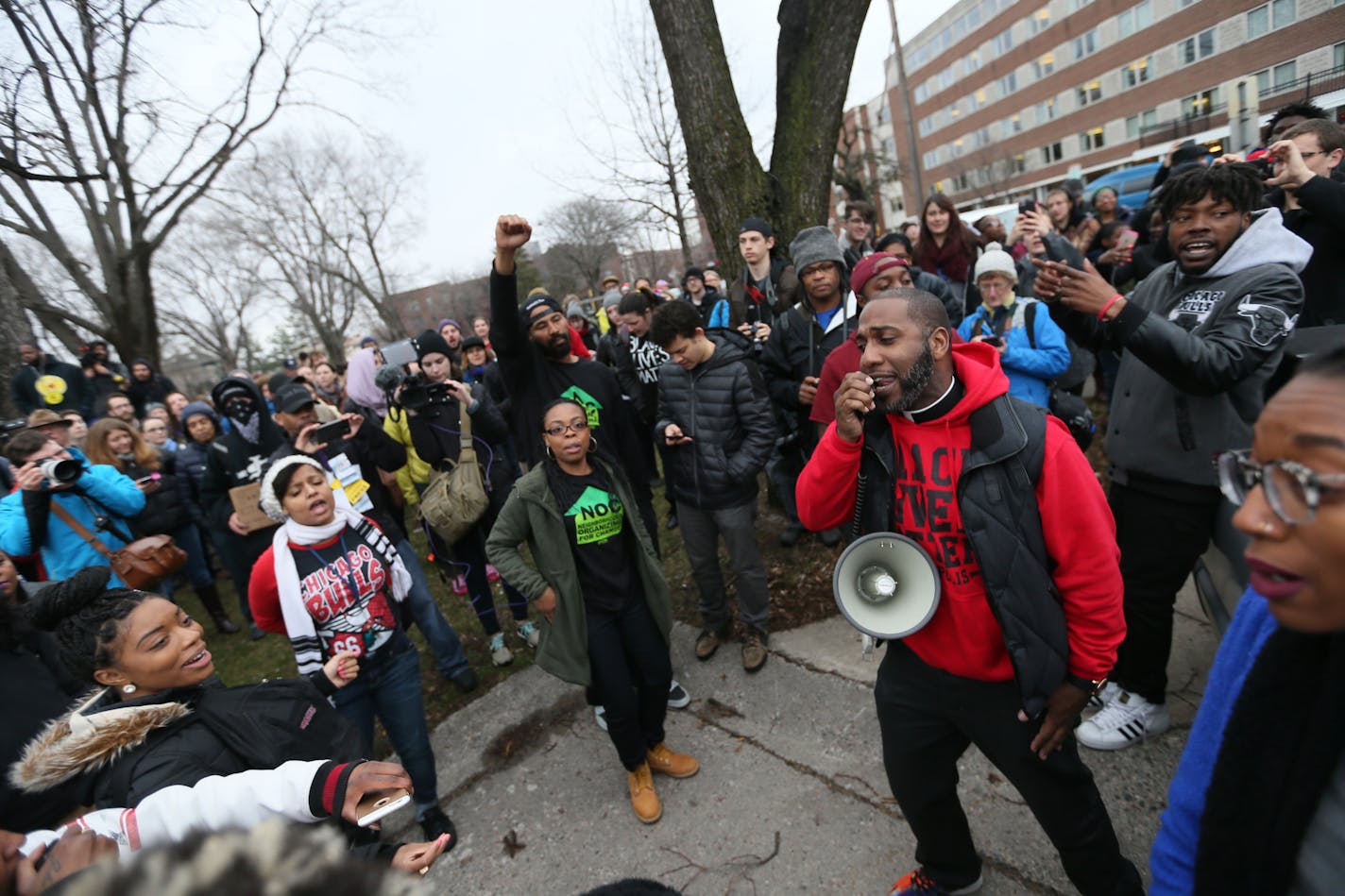 Protesters rally at Elliot Park, following the announcement that there will be no charges against Minneapolis police officers in the shooting death of Jamar Clark.