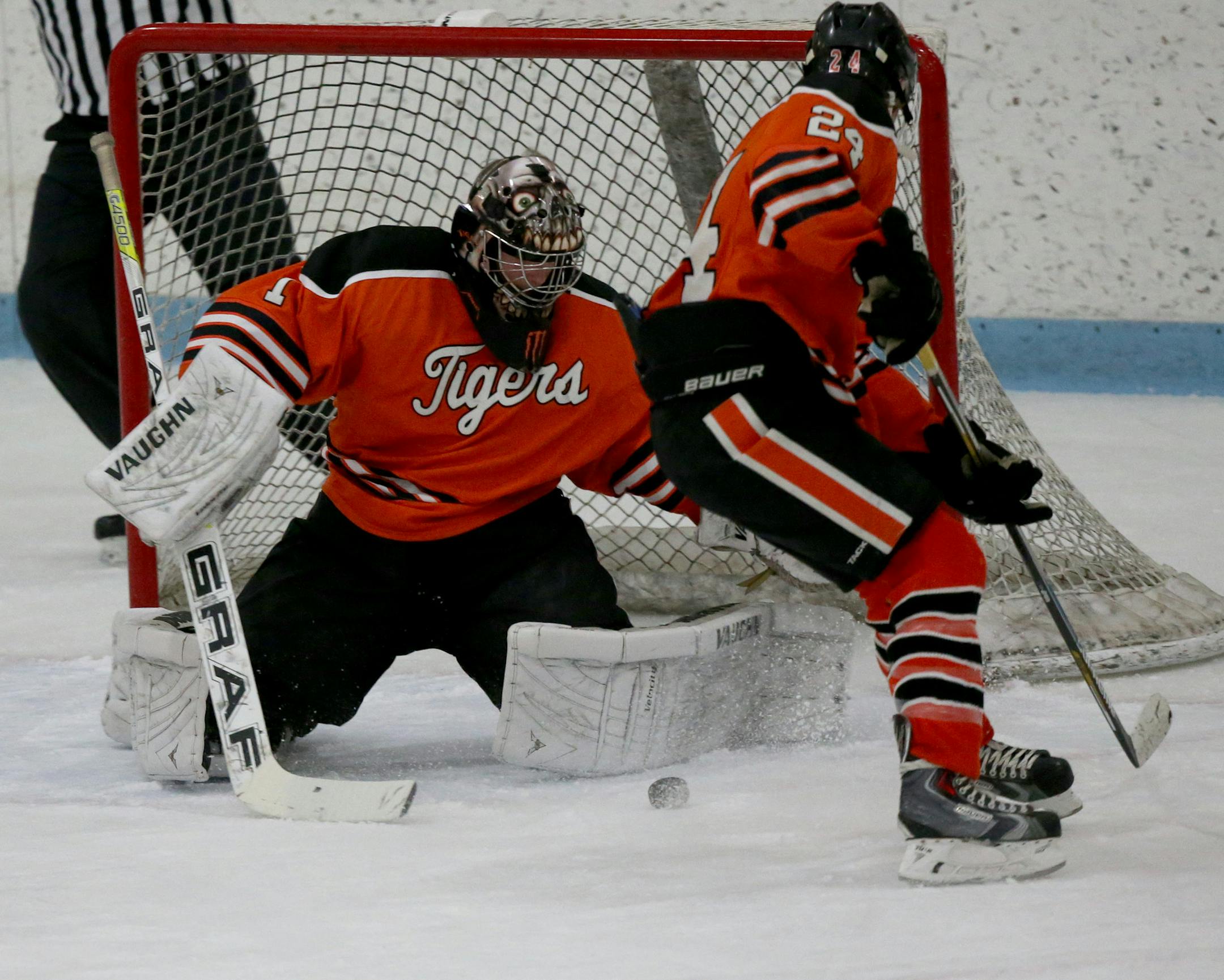Farmington goalie Gage Overby gathered up the puck after a shot on goal by Eastview. (KYNDELL HARKNESS/STAR TRIBUNE)