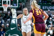 Michigan State's Tory Ozment celebrated after making a three-pointer against the Gophers during the first quarter.