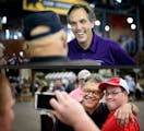 GOP Senate candidate Mike McFadden laughed with Larry and Evy Walters of Brooklyn Park in the State Fair Cattle Barn. Larry Walters then asked if he c