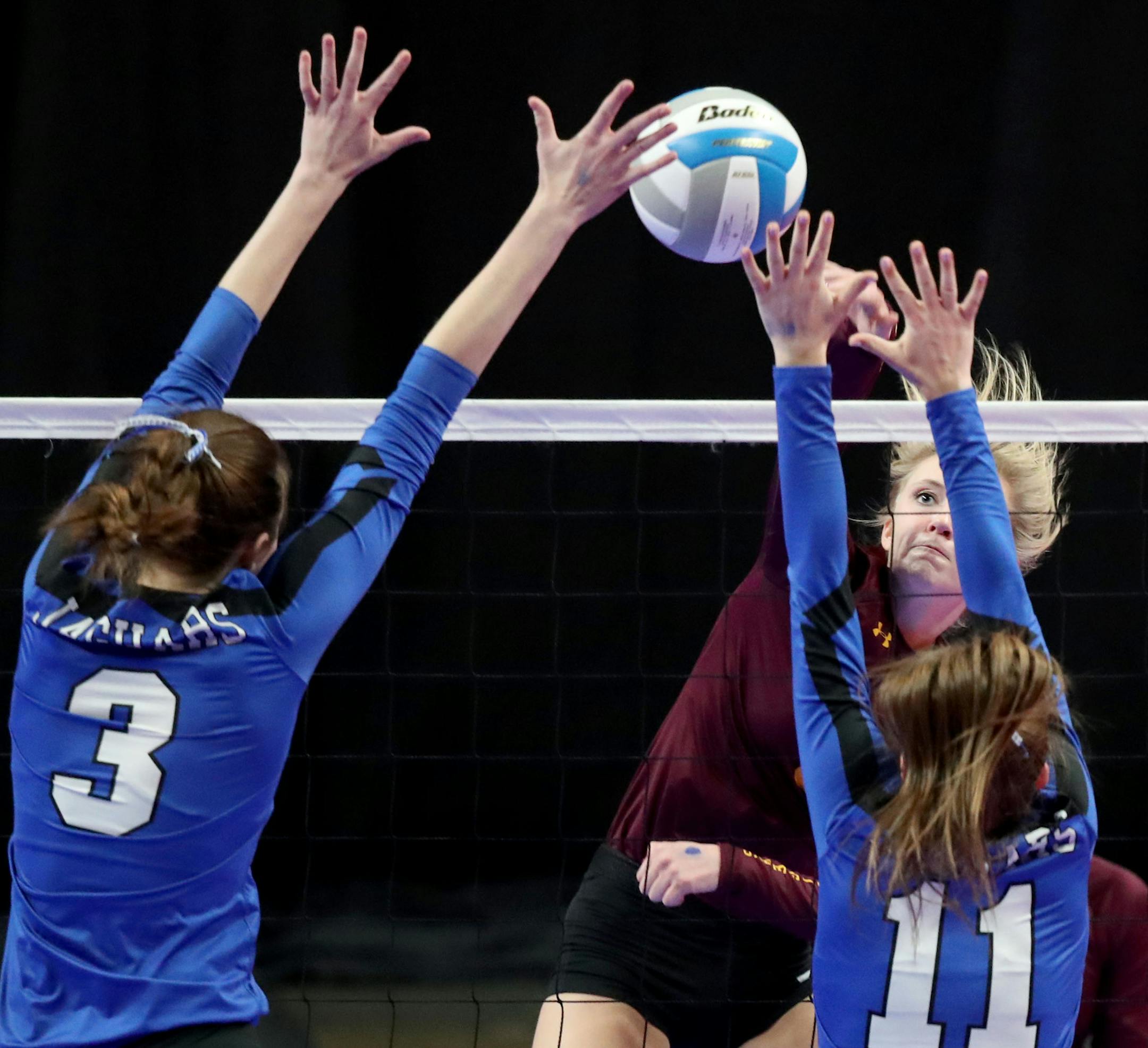 Medford's Emma Kniefel (8) spikes a shot against Belgrade-Brooten-Elrosa's Karsee Kampsen (11) and Kylie Winter (3) during the Girls Volleyball Class 1A State semifinal match Friday, November 9, 2018, at the Xcel Energy Center in St. Paul, MN. Medford beat Belgrade-Brooten-Elrosa 3-1 to advance to the championship.] DAVID JOLES ï david.joles@startribune.com Girls Volleyball Class 1A State semifinal