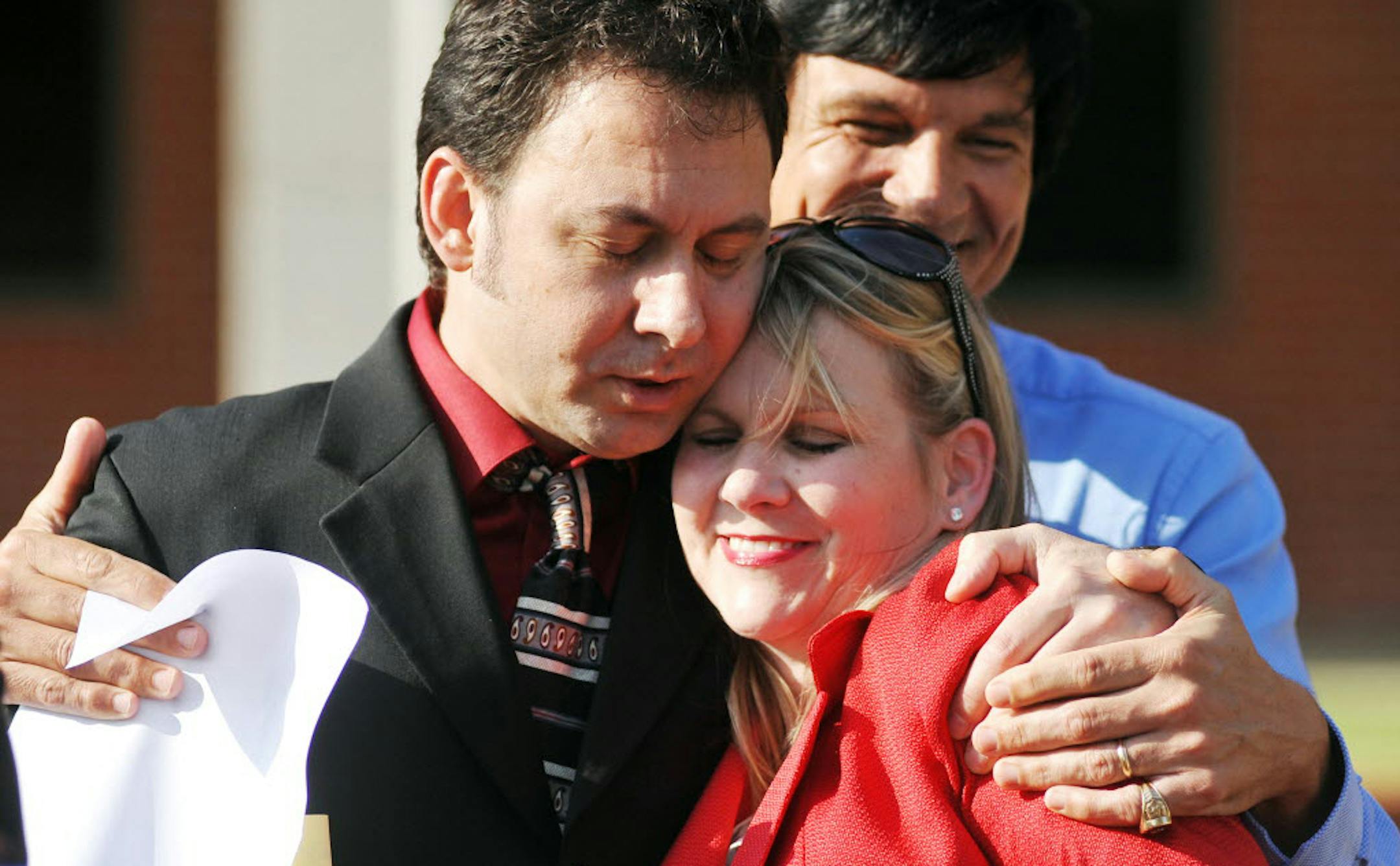 Paul Kevin Curtis, who had been in custody under suspicion of sending ricin-laced letters to President Barack Obama and others, left, hugs his attorney Christi McCoy following his release Tuesday, April 23, 2013 in Oxford, Miss.