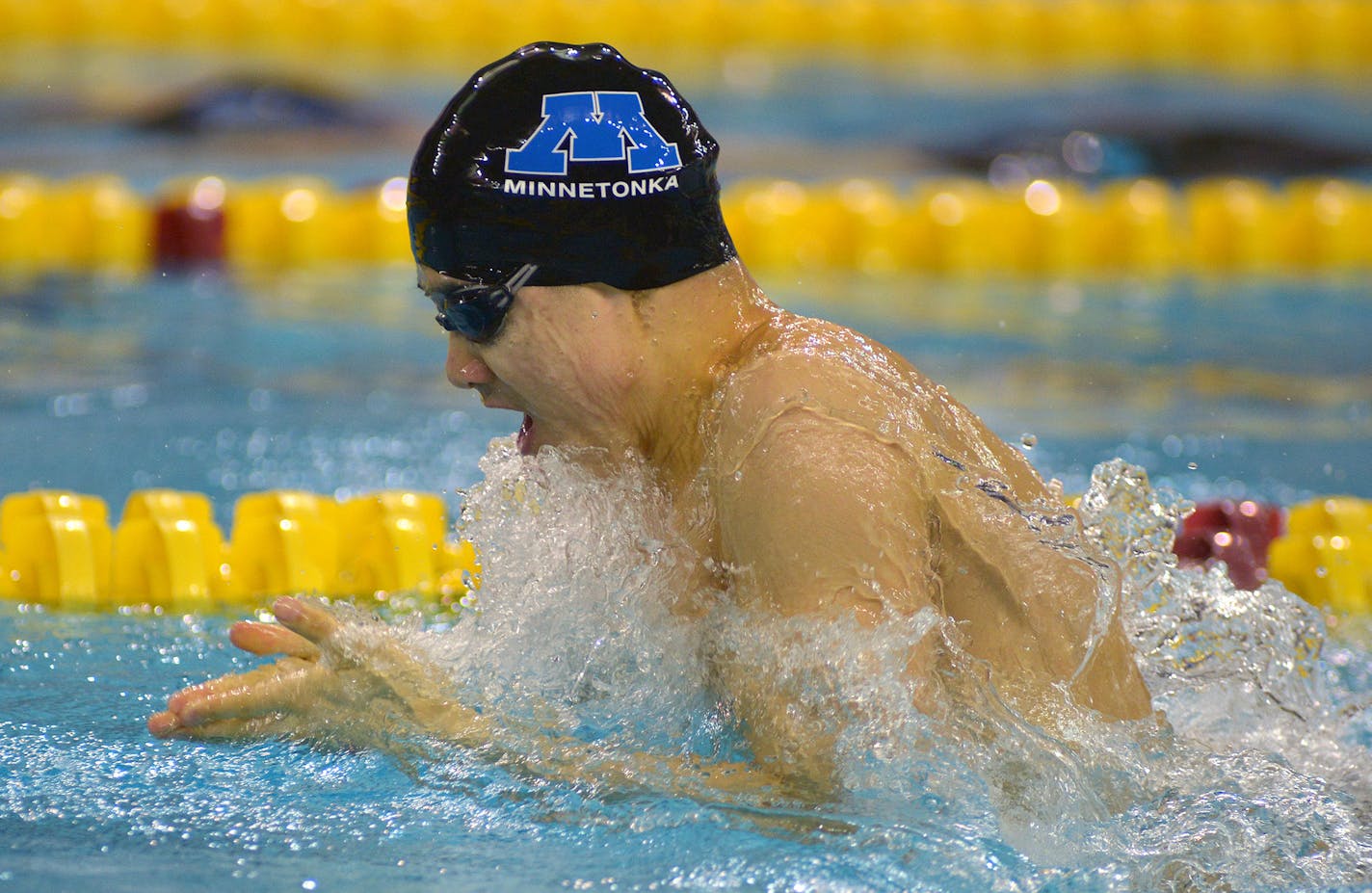 Minnetonka junior Corey Lau competes in the 200 yard medley relay during the Class 2A boys' state swimming tournament preliminaries Friday night at the University of Minnesota's Aquatic Center. The relay team of Quinn Yeager, Lau, Markus Paulson-Luna and Joe Ackerson advance to the finals with a second place finish. ] (SPECIAL TO THE STAR TRIBUNE/BRE McGEE) **Corey Lau (junior), Quinn Yeager (not pictured), Markus Paulson-Luna (not pictured), Joe Ackerson (now pictured)