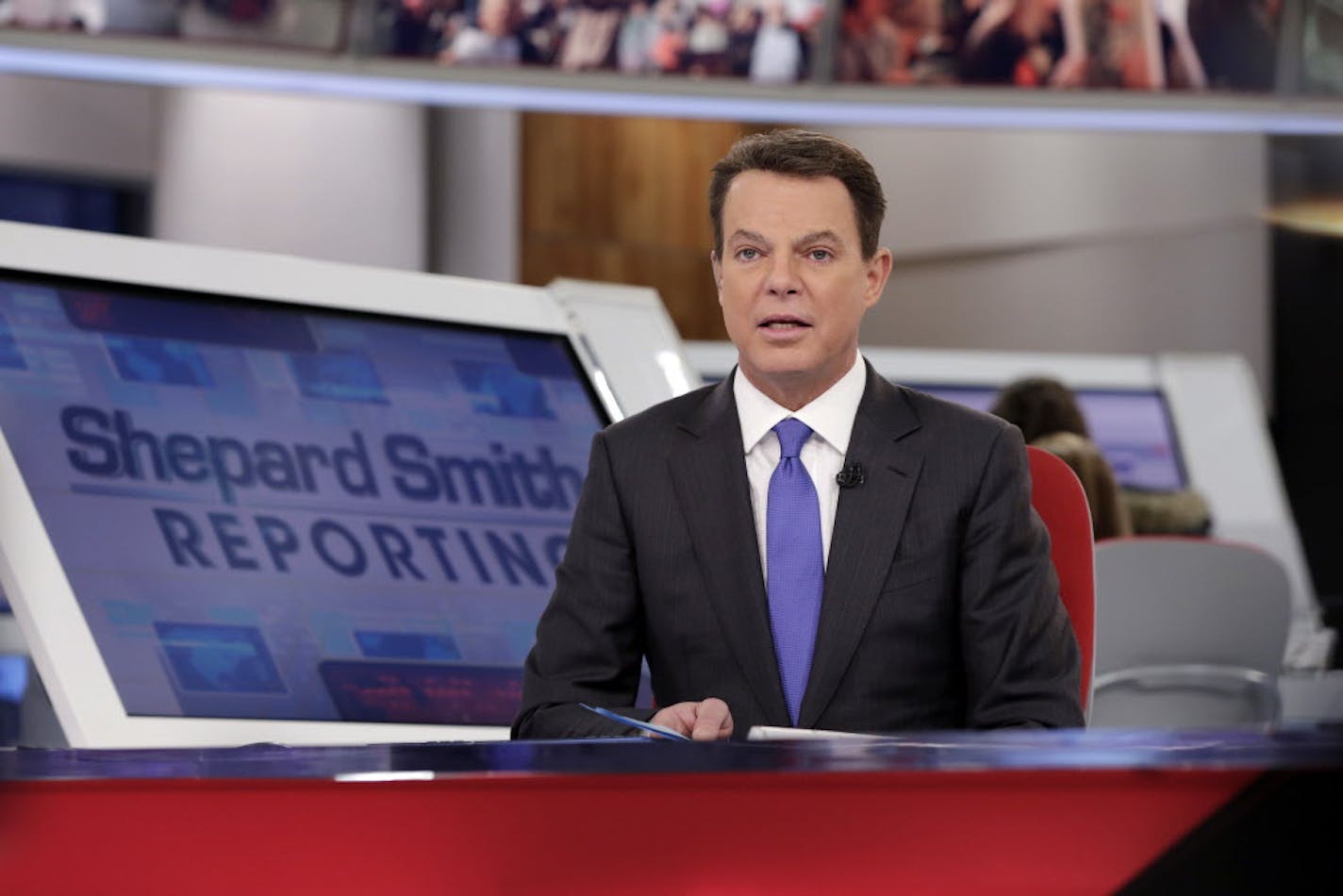 Fox News Channel chief news anchor Shepard Smith broadcasts from The Fox News Deck during his "Shepard Smith Reporting" program, in New York, Monday, Jan. 30, 2017. (AP Photo/Richard Drew)