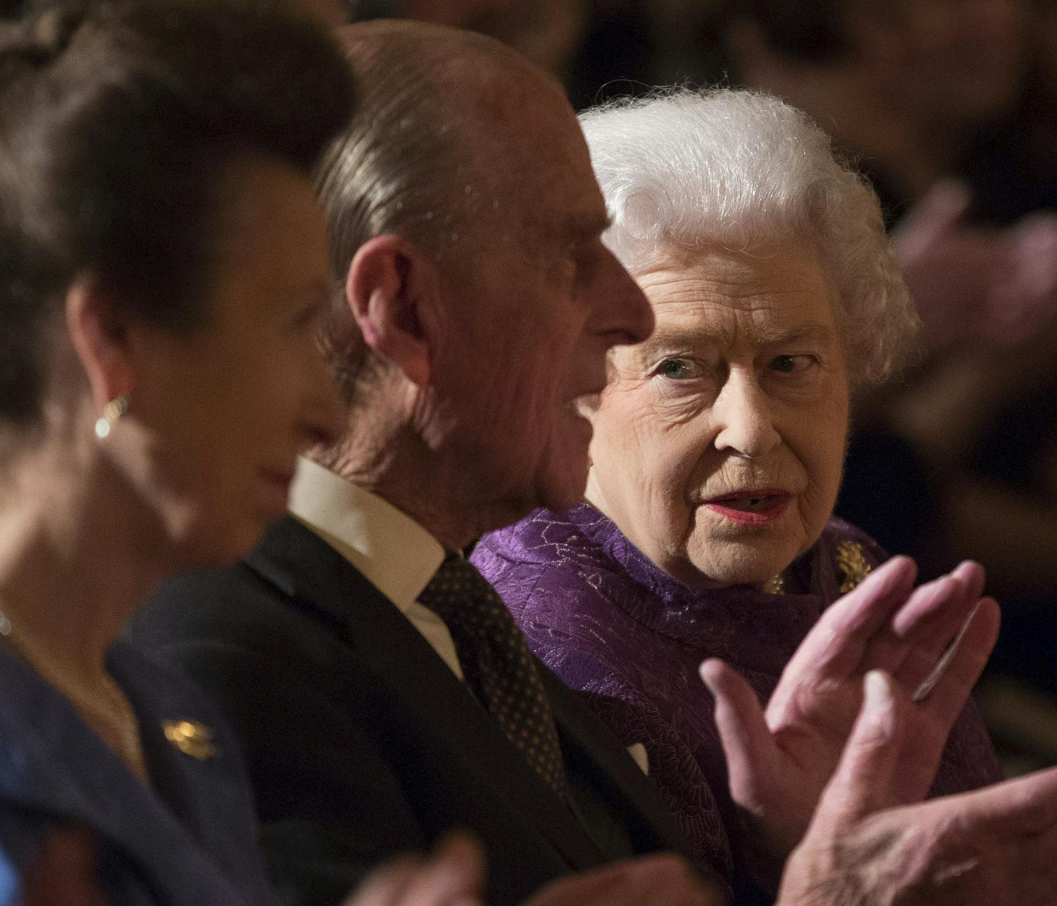 Britain's Princess Royal (left), Prince Philip, the Duke of Edinburgh and Queen Elizabeth II, listen to poetry readings during a Reception for Contemporary British Poetry at Buckingham Palace, London, Tuesday Nov.19, 2013. Four poet laureates were among the 300 guests. Actors, singers, poetry and English literature teachers, plus other academics and war poets were also among those handpicked to represent the United Kingdom and the Commonwealth. (AP Photo / Gareth Fuller/PA)