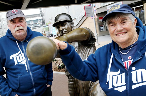 Gregg Scherer and his mother Nancy Scherer, 83, at the Harmon Killebrew statue, outside Target Field Friday, May 8, 2015, in Minneapolis, MN. The moth