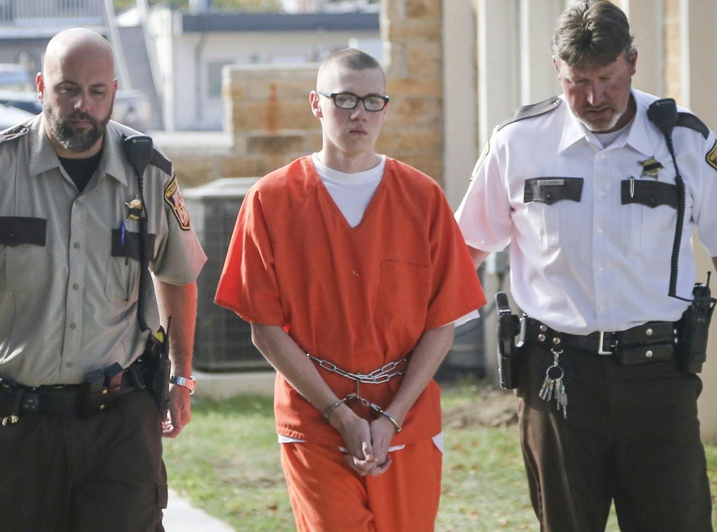 John LaDue walked into the Waseca County Courthouse flanked by officers to his sentencing in Waseca, Minn., on Monday, October 19, 2015.