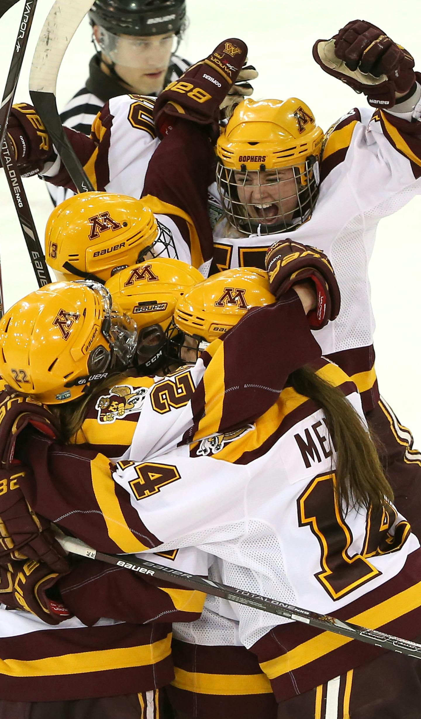 Gopher's Kelly Terry jumped on her teammates as they celebrated Hannah Brandt's goal during third period. ] (KYNDELL HARKNESS/STAR TRIBUNE) kyndell.harkness@startribune.com Minnesota vs Wisconsin during the semifinals round of the NCAA Women's Frozen Four in Hamden, Conn Friday, March 21, 2014. Gophers won over the Badgers 5-3.