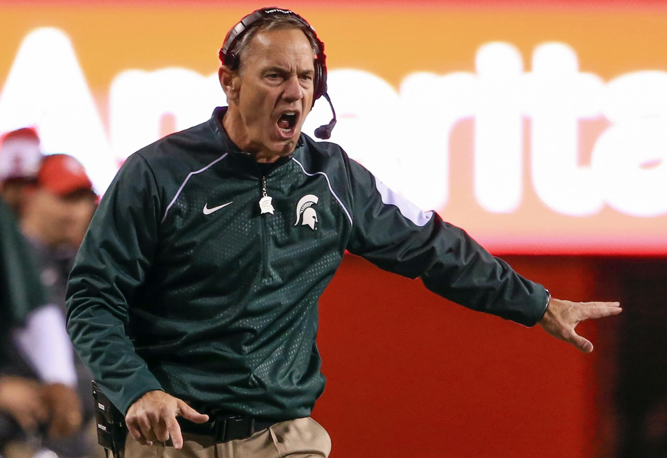 Michigan State head coach Mark Dantonio reacts to a pass interference call during the first half of an NCAA college football game against Nebraska in Lincoln, Neb., Saturday, Nov. 7, 2015. (AP Photo/Nati Harnik)