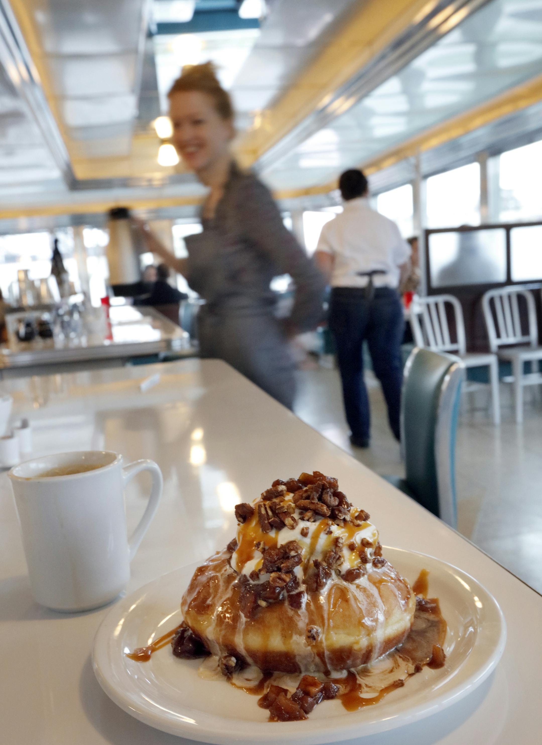 At the Hi-Lo Diner in Minneapolis, bartender Hadley Musselman serves the Minneapolis Bliss, Baked apples, creamy sea salt caramel and pecans.