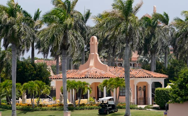 Security moves in a golf cart at former President Donald Trump’s Mar-a-Lago estate, Tuesday, Aug. 9, 2022, in Palm Beach, Fla.