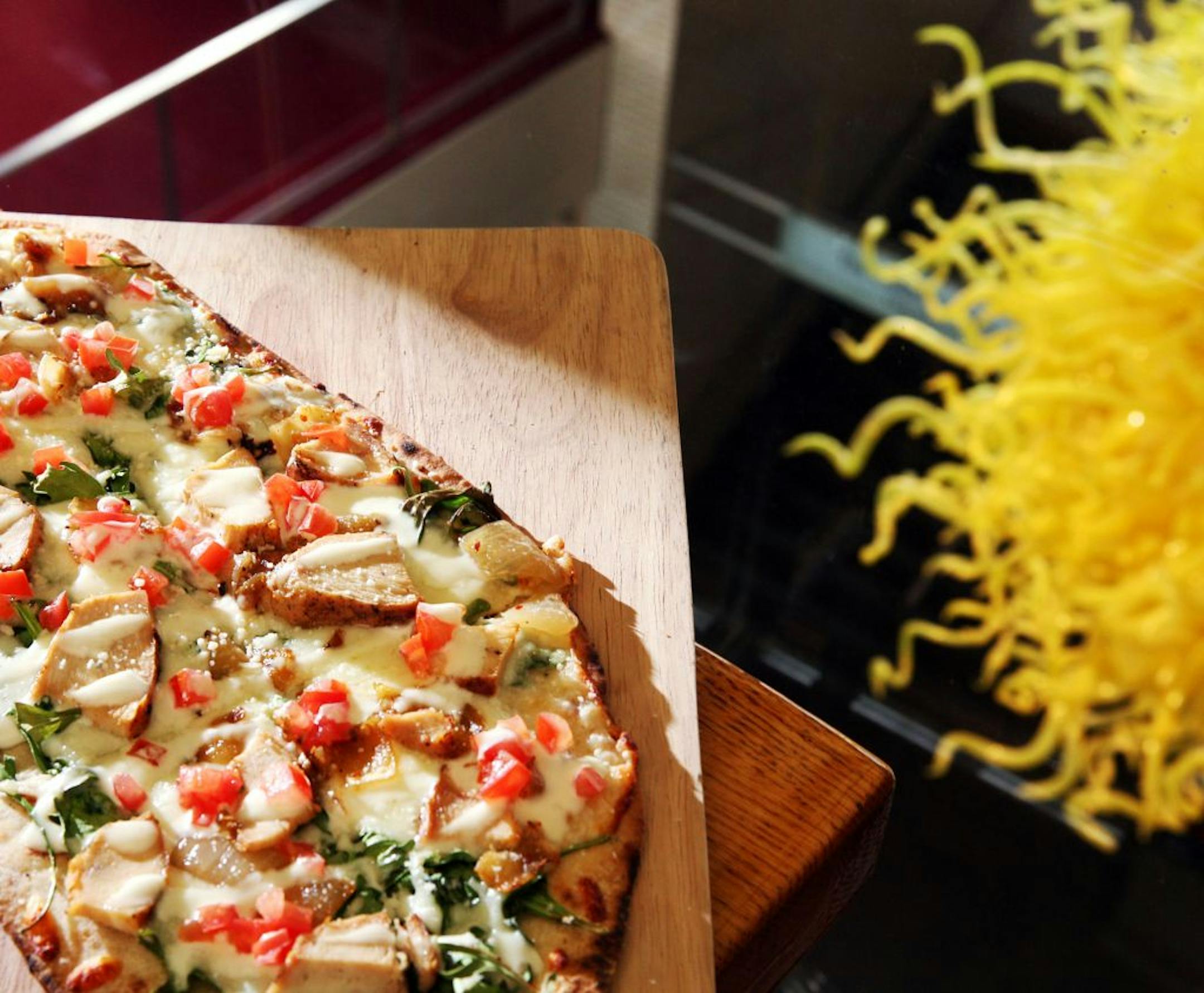 A Mezzanine favorite: Grilled chicken flatbread with caramelized onion, spinach, crema and mozzarella.