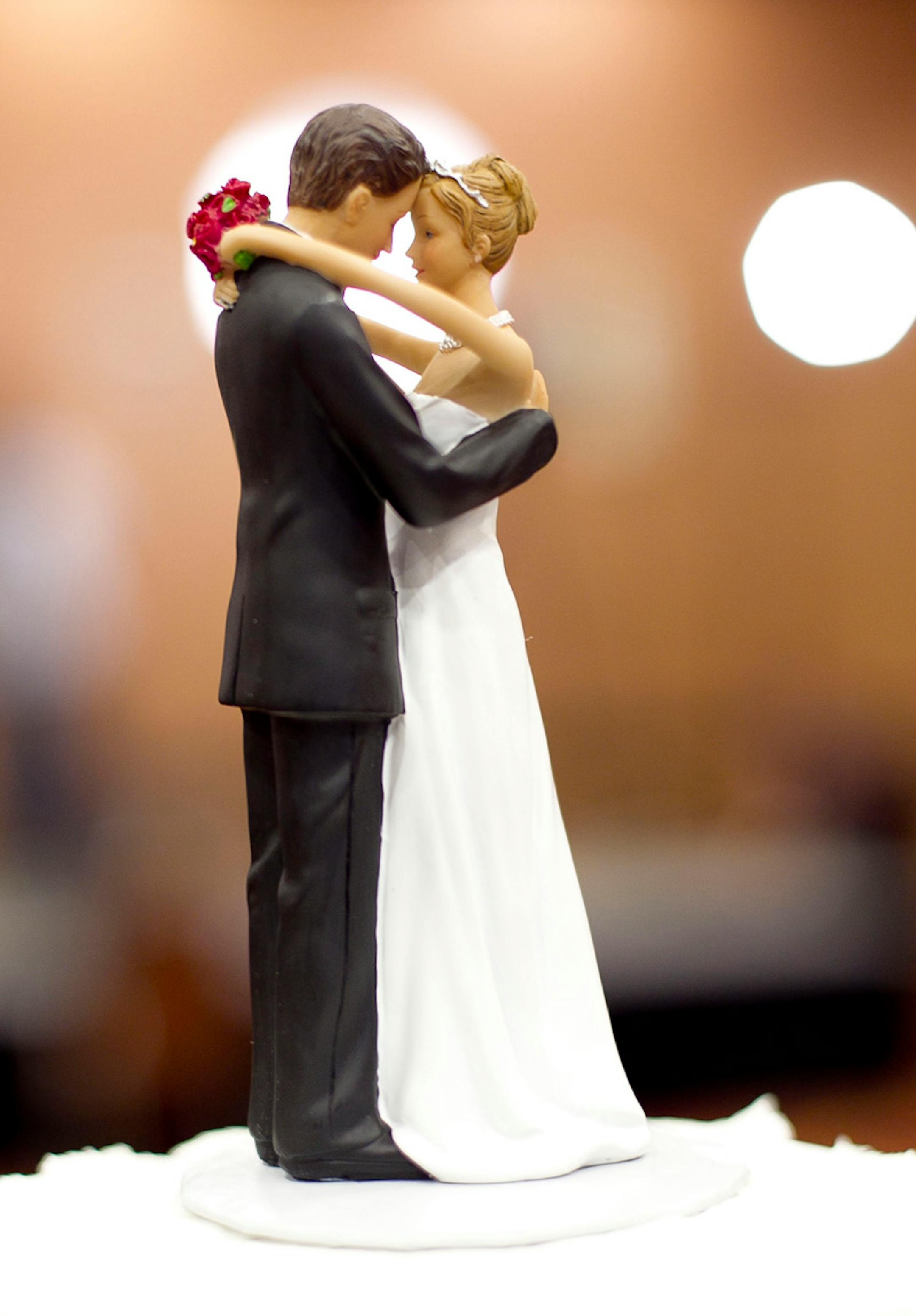 A figurine of a bride and a groom sits atop a wedding cake during an election party at the North Raleigh Hilton on Tuesday, May 8, 2012. Organizers plan to cut the cake if Amendment One, which would ban gay marriage, passes. (Robert Willett/Raleigh News & Observer/MCT)