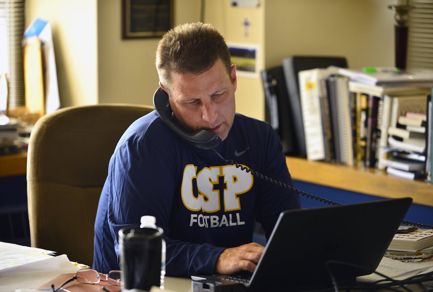 Concordia-St. Paul football head coach Shannon Currier took a call in his office before Wednesday afternoon's practice. ] (AARON LAVINSKY/STAR TRIBUNE) aaron.lavinsky@startribune.com Concordia-St. Paul has brought back Shannon Currier as coach. Currier had four winning seasons in as many years at Concordia before moving to Truman State, where he was fired after five years. After working seven years as a sales manager, he's back at Concordia, which was 1-10 a year ago. We photograph a mid-week Pr