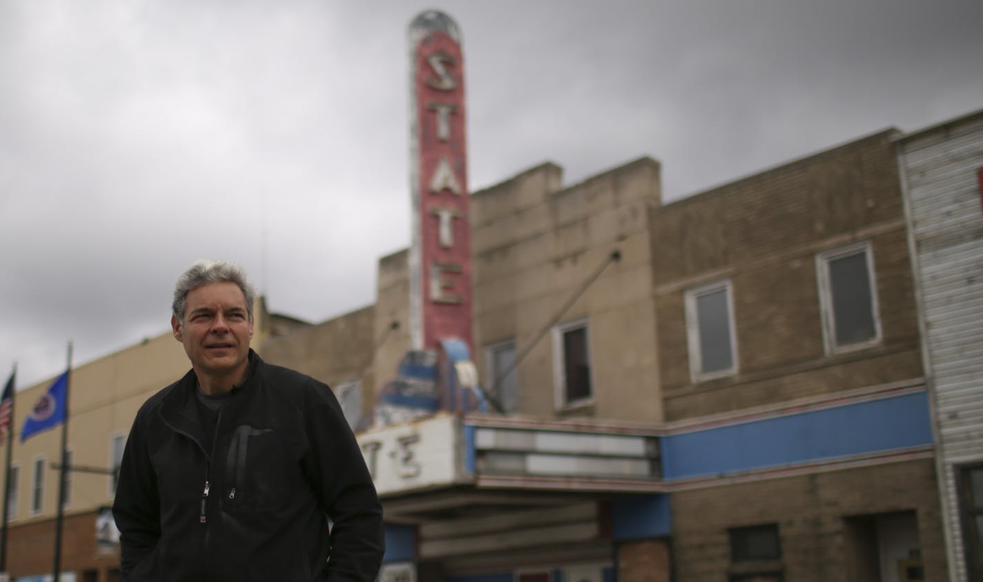 John Ott, walking across E. Sheridan St. Tuesday morning in front of the movie theater and another building he now owns in downtown Ely. ] JEFF WHEELER &#x2022; jeff.wheeler@startribune.com The tourism and mining town of Ely has been struggling with its downtown commercial district. But the locals are hopeful: John Ott, a redeveloper from Missouri who has a cabin nearby bought four buildings to restore, including the theater and the long-empty, castle-like old hospital. John Ott was photographed