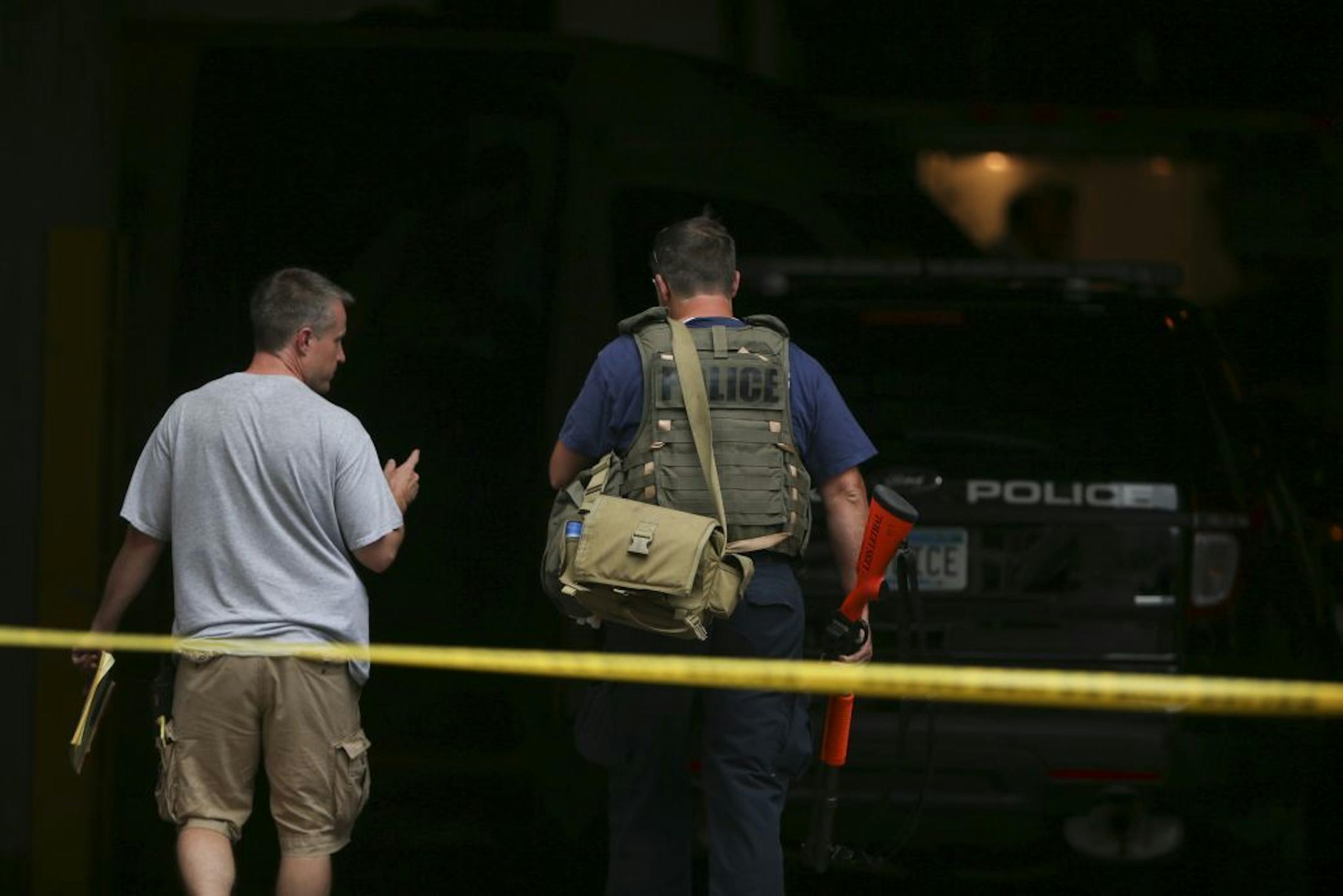 A SWAT team member went back into the Hilton after retrieving a specialized "bean bag" shotgun from his vehicle outside at the Minneapolis hotel late Thursday afternoon.