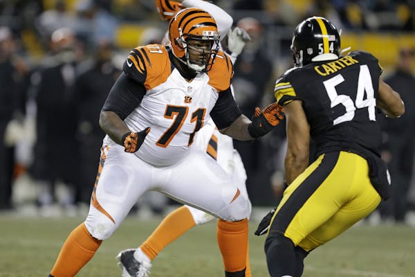 Cincinnati Bengals tackle Andre Smith (71) blocks Pittsburgh Steelers outside linebacker Chris Carter (54) during the fourth quarter of an NFL footbal