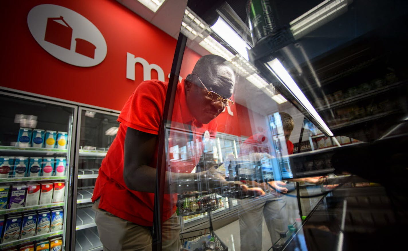 Target workers assemble a soft drink display case in the new store. Target Corp's first Target Express store is scheduled to open soon in Dinkeytown next to the University of Minnesota. ] GLEN STUBBE * gstubbe@startribune.com July 21, 2014