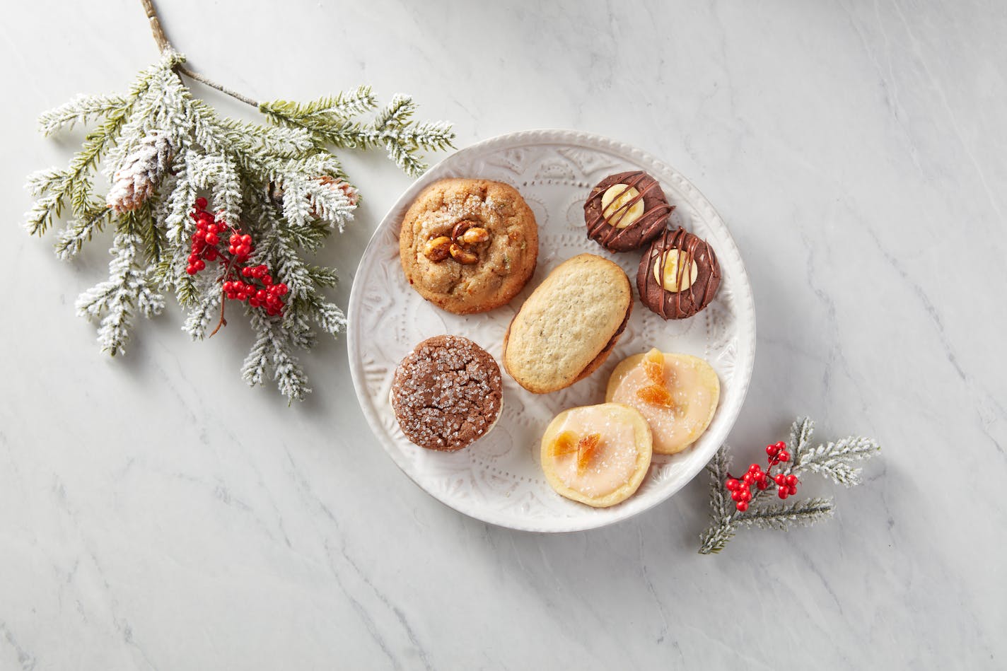 The winning cookies of the 2023 Star Tribune Holiday Cookie Contest. Center, Earl Grey Butter Cookies with Dark Chocolate and Orange Filling (the winner), and finalists: Good Thai Dings, Nanaimo Bar Thumbprint Cookies, Aperol Sparklers and Ginger Chocolate Bliss. Photo by Dennis Becker, food styling byLisa Golden Schroeder.