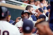Twins right fielder Torii Hunter celebrated with teammates after scoring in the fourth inning at Target Field Wednesday.