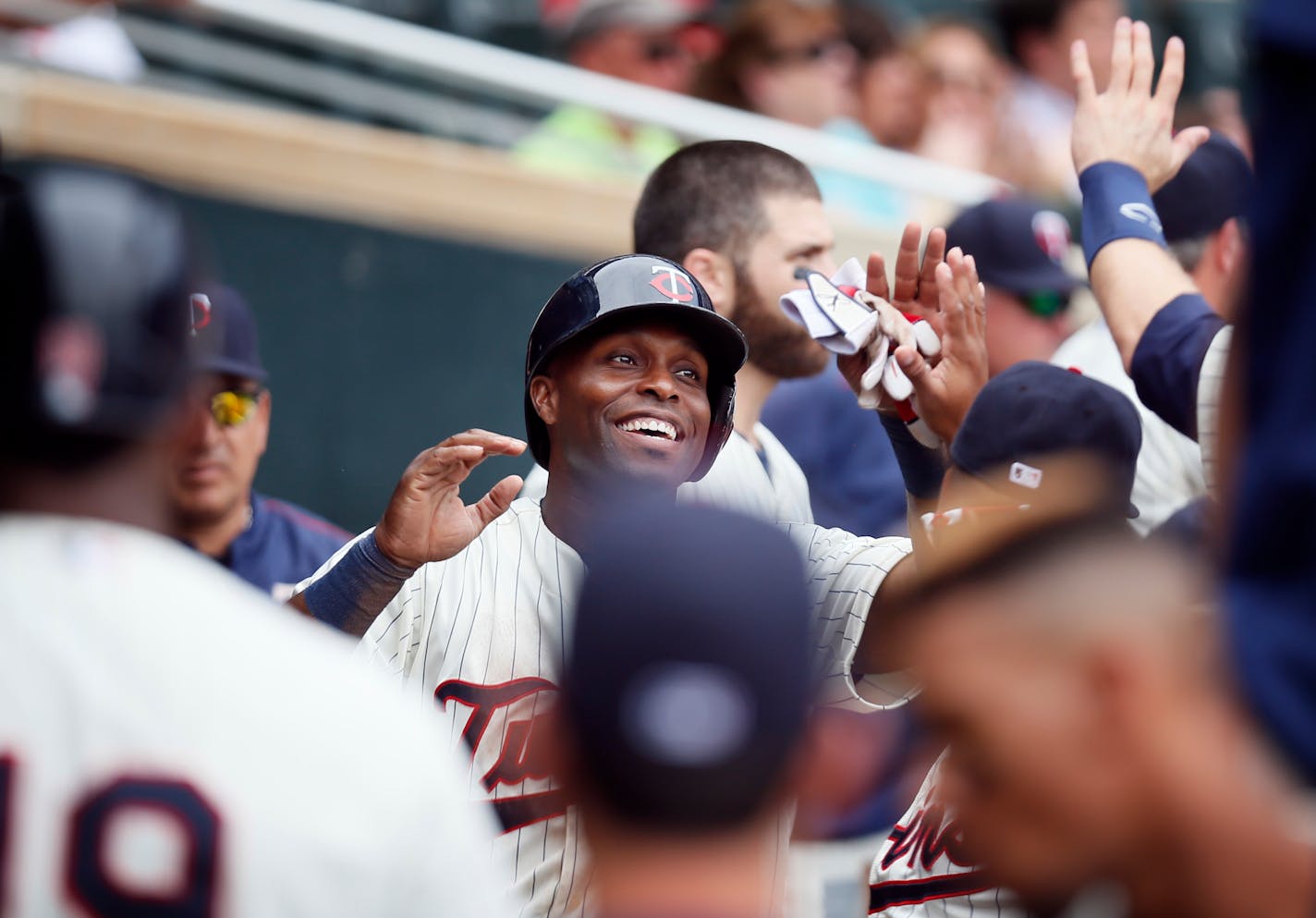 Twins right fielder Torii Hunter celebrated with teammates after scoring in the fourth inning at Target Field Wednesday.