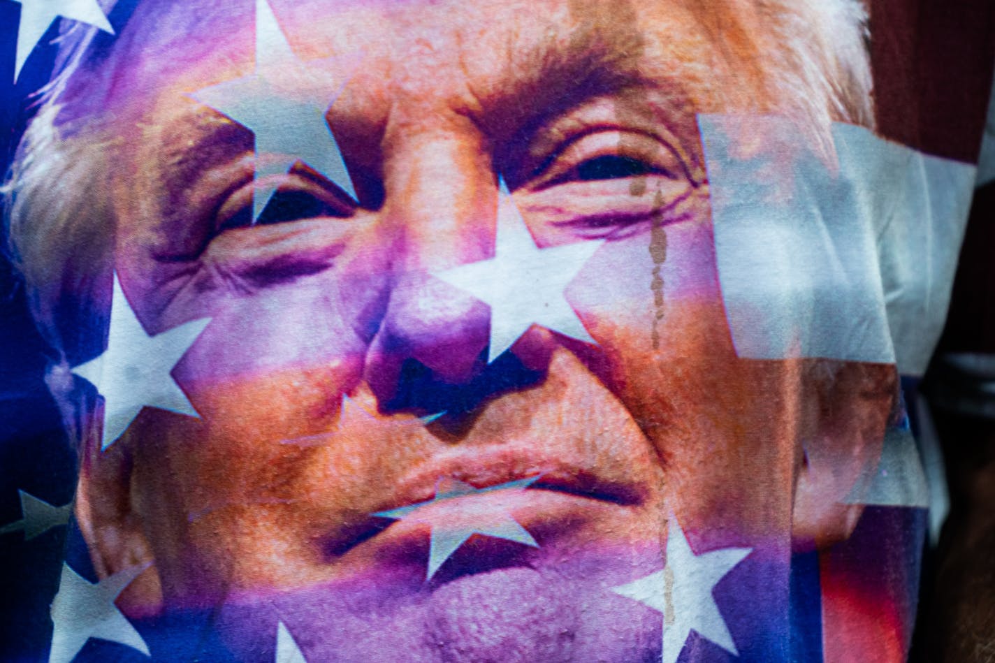 The face of former president Donald Trump on a supporter's shirt during a GOP rally in Wilkes-Barre, Pa., on Sept. 3. MUST CREDIT: Washington Post photo by Demetrius Freeman.