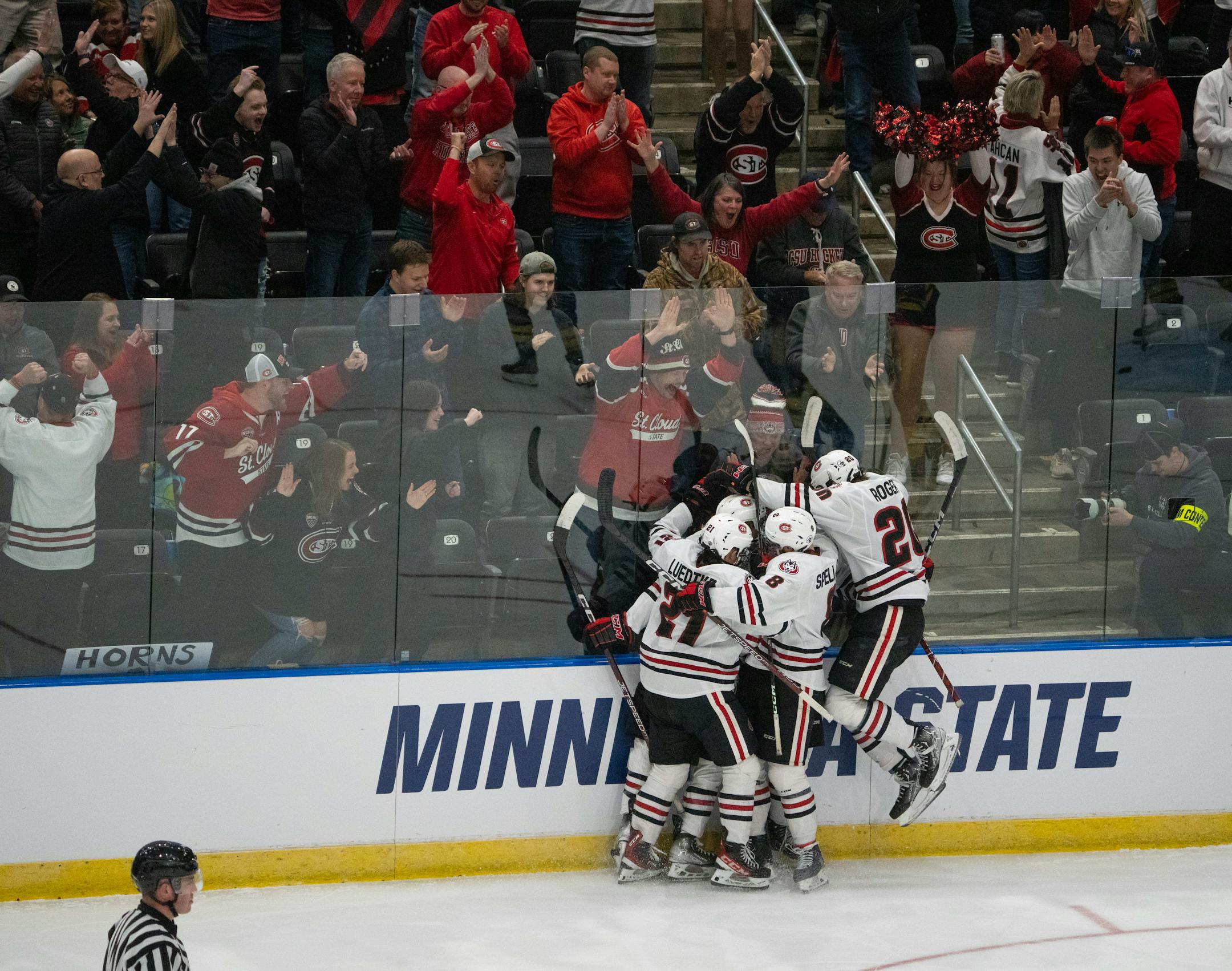 St. Cloud State Huskies defenseman Jack Peart was mobbed by his line mates after his second period goal.