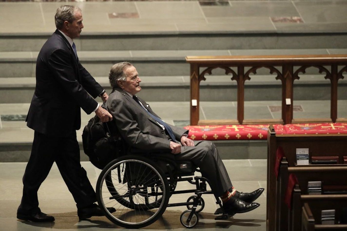 Former Presidents George W. Bush, left, and George H.W. Bush arrive at St. Martin's Episcopal Church for a funeral service for former first lady Barbara Bush, Saturday, April 21, 2018, in Houston.