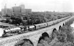 Great Northern Railway’s first Empire Builder is pictured on the Stone Arch Bridge crossing the Mississippi River, likely in the 1920s or 1930s.