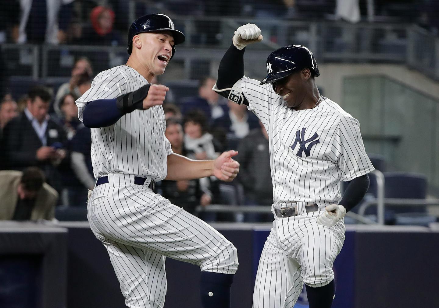 New York Yankees' Didi Gregorius, right, celebrates with Aaron Judge after hitting a two-run home run against the Twins during the fifth inning Tuesday