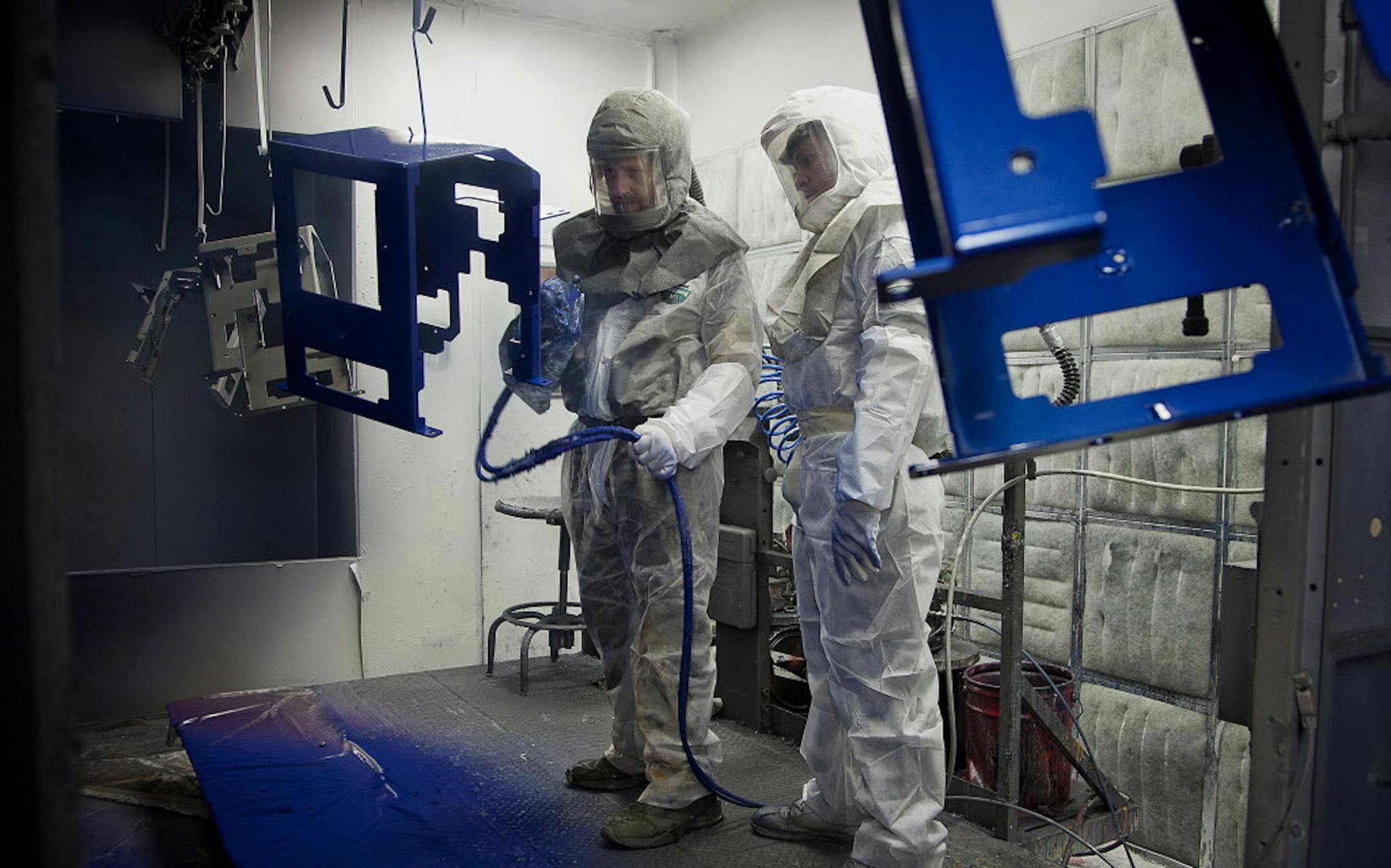 Employee Joe Stelflug, left, and trainee Dwane Whekins paint chassis at the Graco Inc. manufacturing facility in Minneapolis, Minnesota, U.S., on Tuesday, Feb. 5, 2013. The U.S. Federal Reserve is scheduled to release manufacturing production figures on Feb. 15. Photographer: Ariana Lindquist/Bloomberg *** Local Caption *** Joe Stelflug; Dwane Whekins ORG XMIT: 161819514 ORG XMIT: MIN1307011700470833