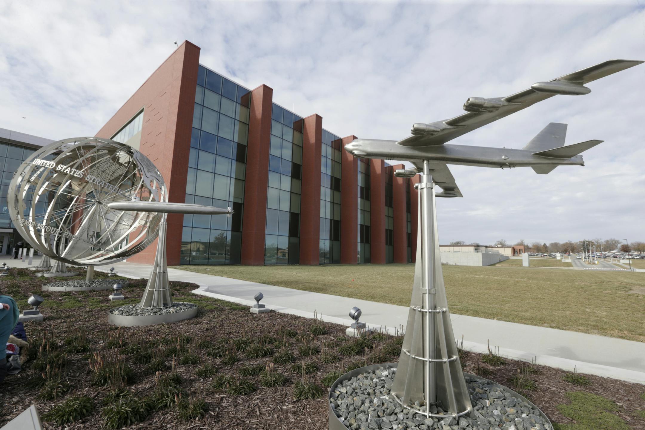 A statue of a B-52 bomber stands in front of C2F, US Strategic Command's new command and control facility at Offutt AFB in Neb, is seen following a dedication ceremony in honor of General Curtis E. LeMay , Monday, Nov. 18, 2019. (AP Photo/Nati Harnik)