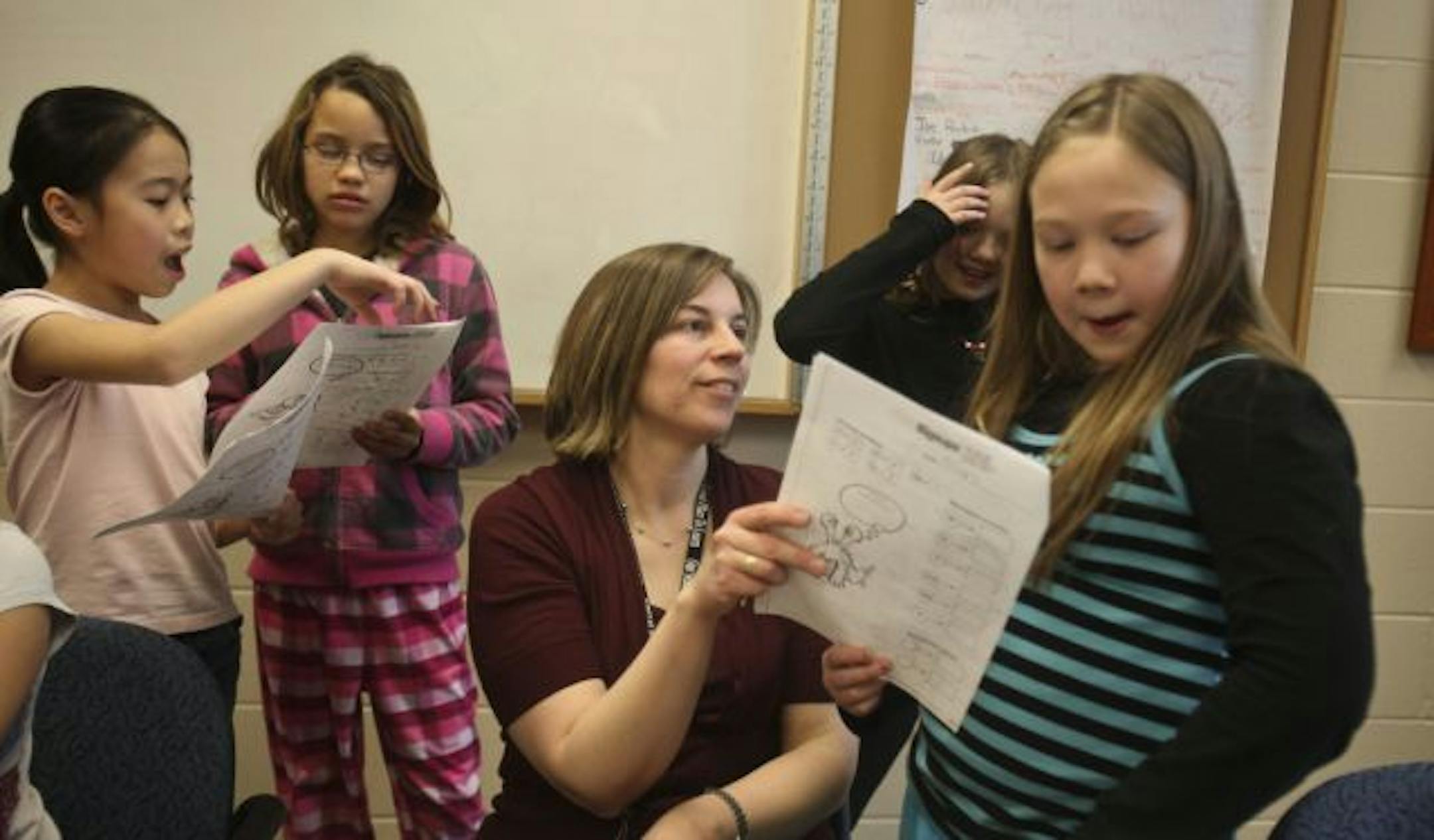 Fourth graders from left Christy Liu, Destiny Wegwort went over the question they had as Teacher Michelle Freisinger helped Makayla Lende- Allison Cha during the Young Scholars Program at Richardson Elementary School.