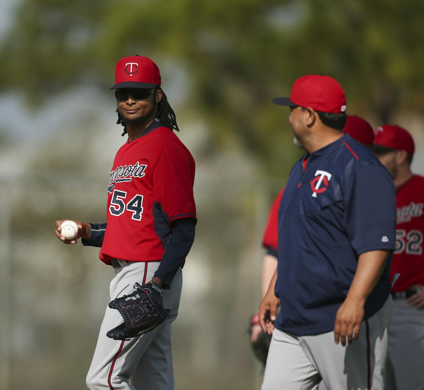 The Twins' Ervin Santana smiled at coach Eddie Guardado before he and some other pitchers started a drill Tuesday morning at Hammond Stadium. ] JEFF WHEELER &#xef; jeff.wheeler@startribune.com Twins pitchers and catchers continued their workouts Tuesday morning, February 24, 2015 at Hammond Stadium in Fort Myers, FL.